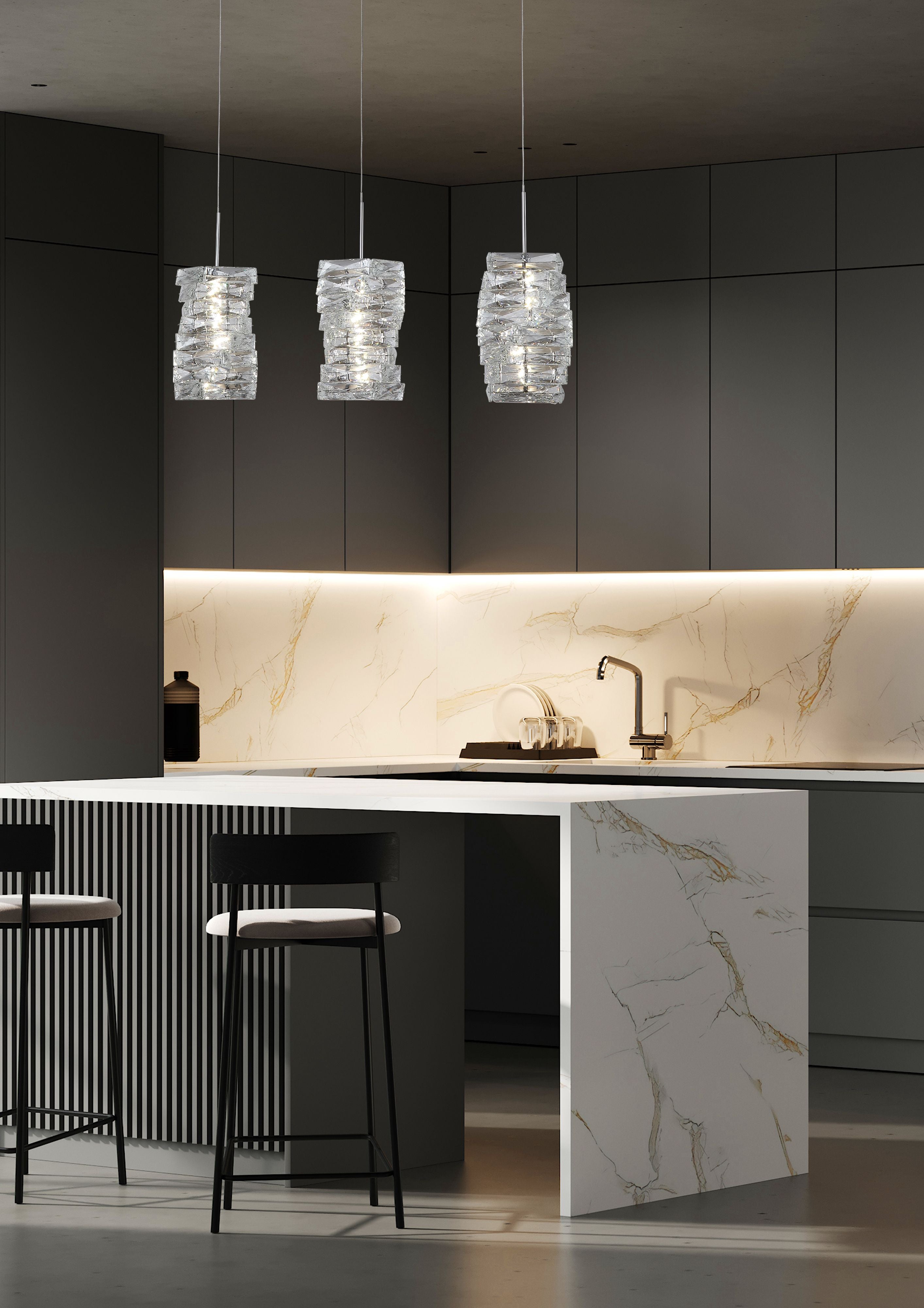 Searchlight Modena LED 3 Light Bar Pendant in chrome with clear crystal, illuminated above a kitchen island with bar stools in a dark modern kitchen