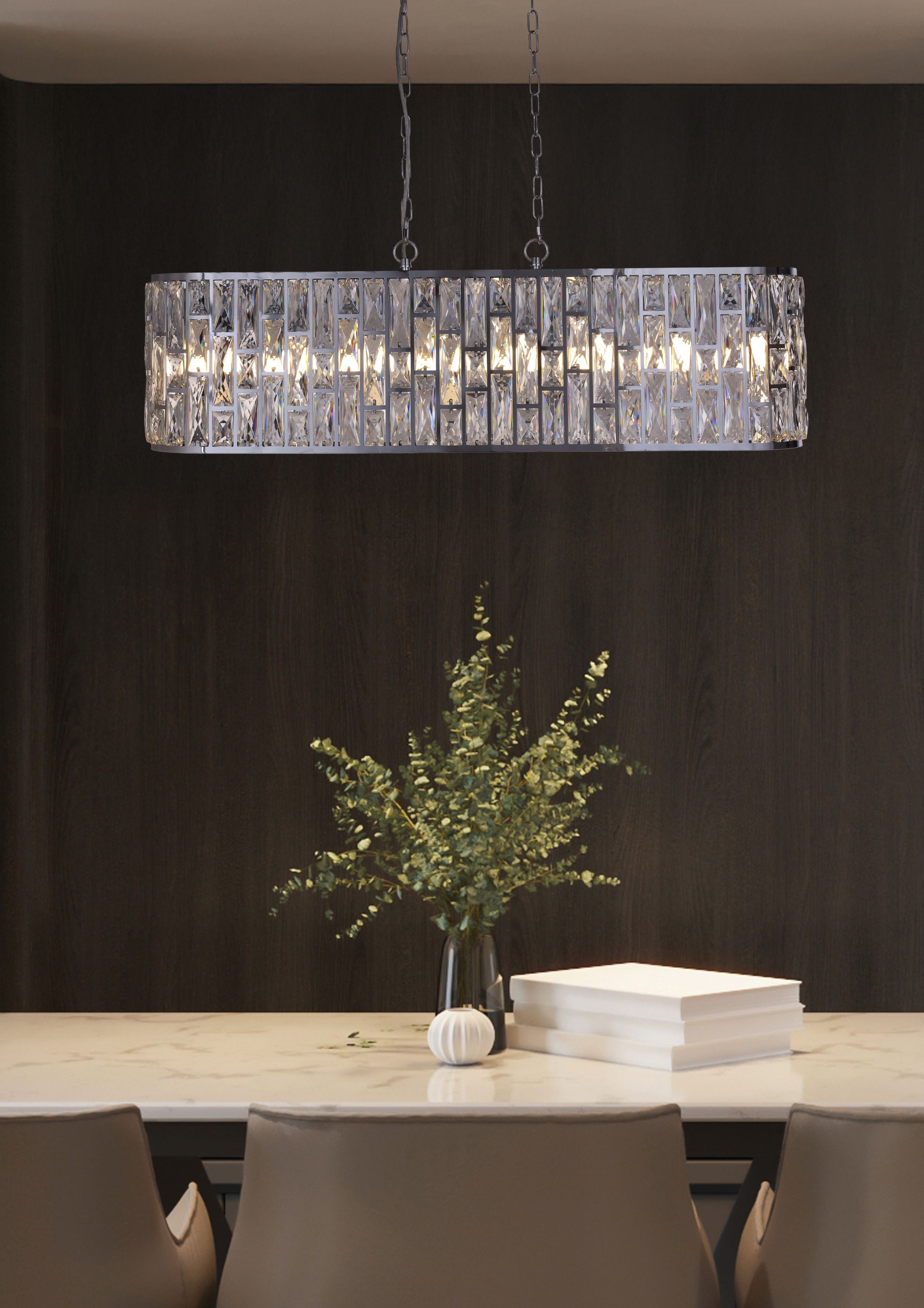 Searchlight Bijou 8 Light Oval Diner Pendant in chrome styled above a marble dining table in a dark panelled room