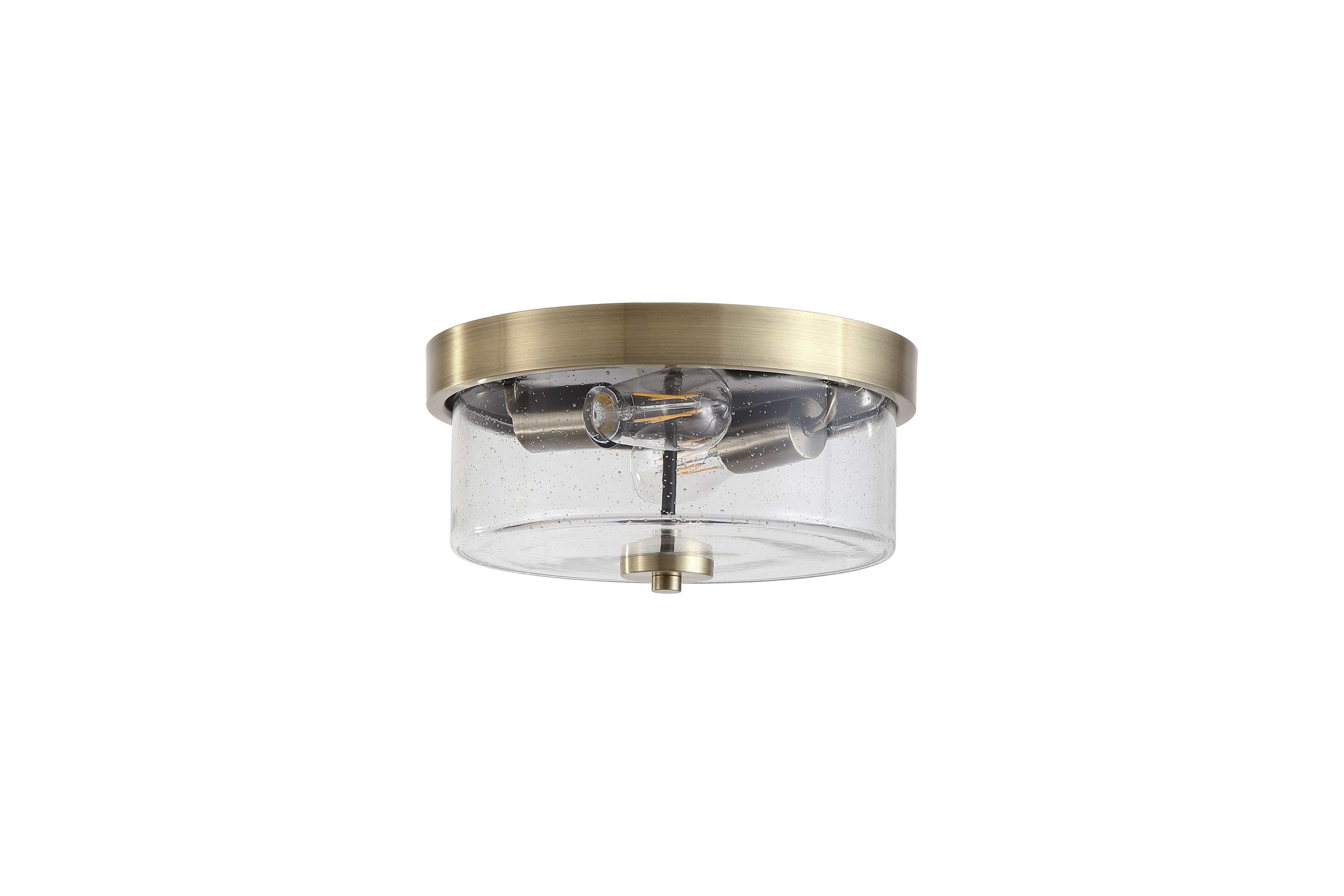 Searchlight Preston 2 light flush ceiling light in antique brass, front on view showing the clear seeded glass drum