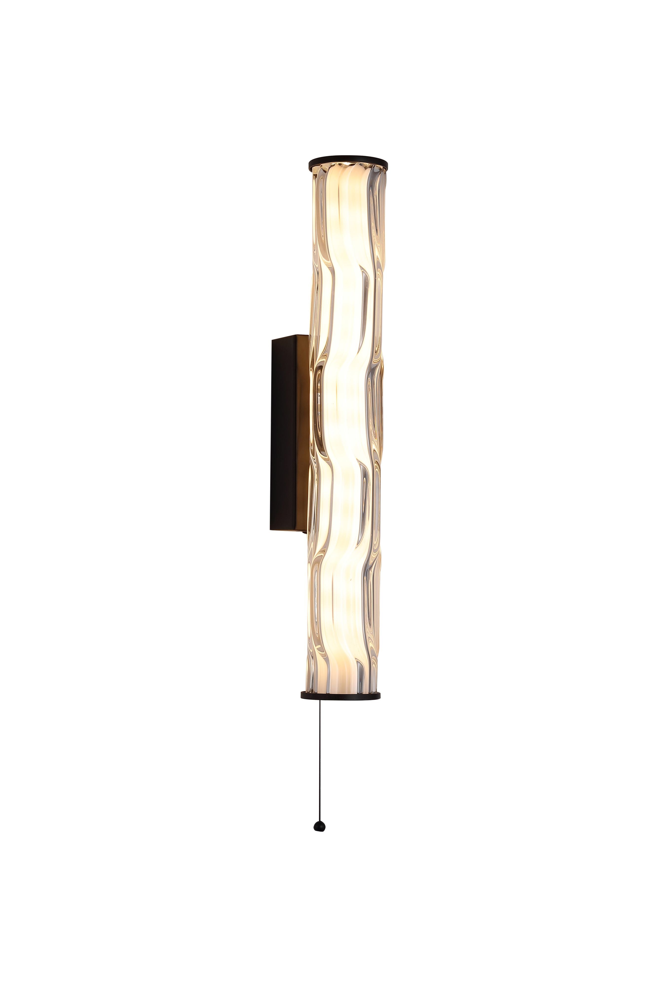 Searchlight Vibrate LED wall light in matt black, angled studio shot of the wave ridged glass shade lit warm white with pull cord switch below