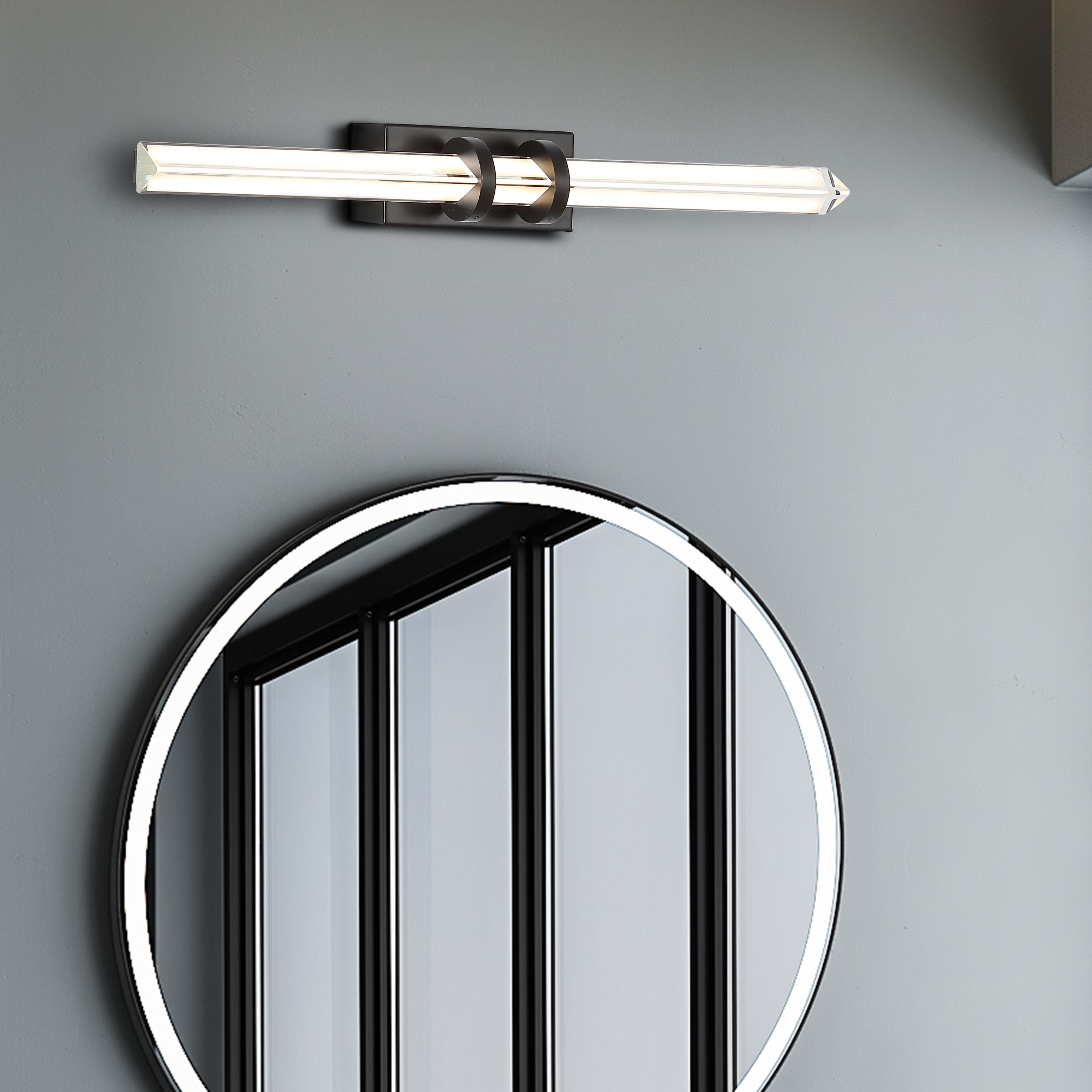Searchlight Parma LED wall light in matt black mounted above a round black framed mirror on a grey bathroom wall