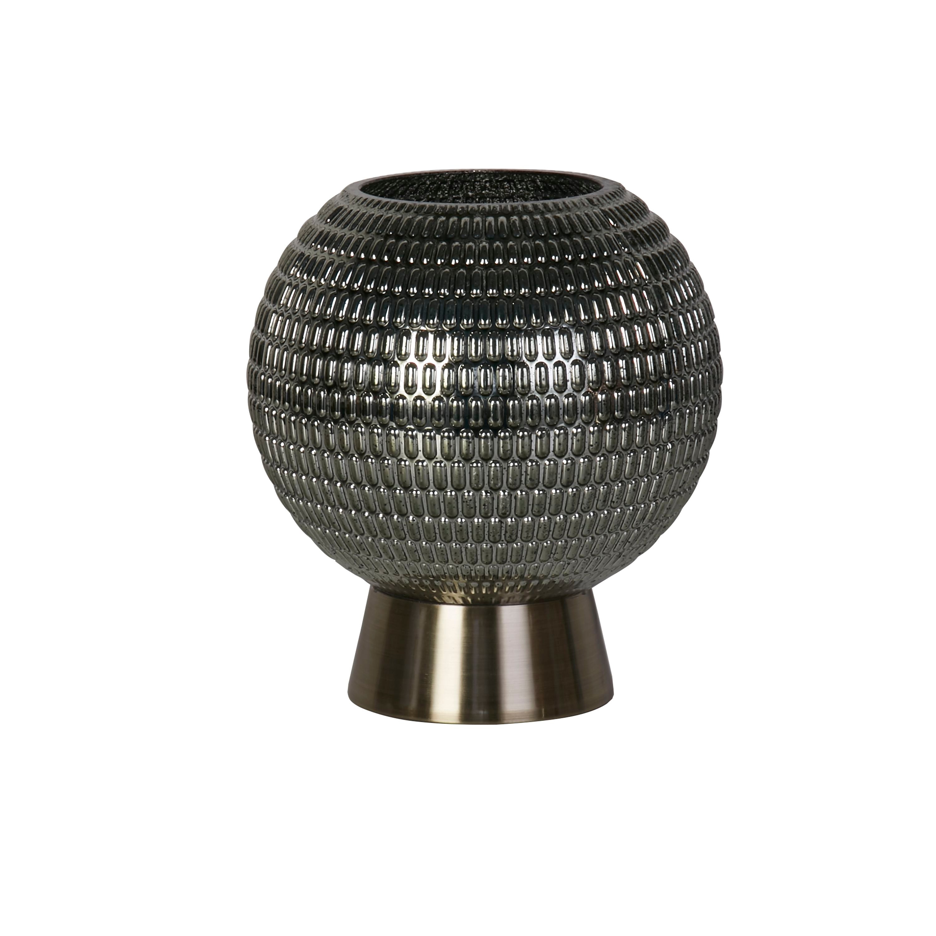 Searchlight Mila table lamp, front view of the textured green glass globe and brass pedestal base, lit against a white background