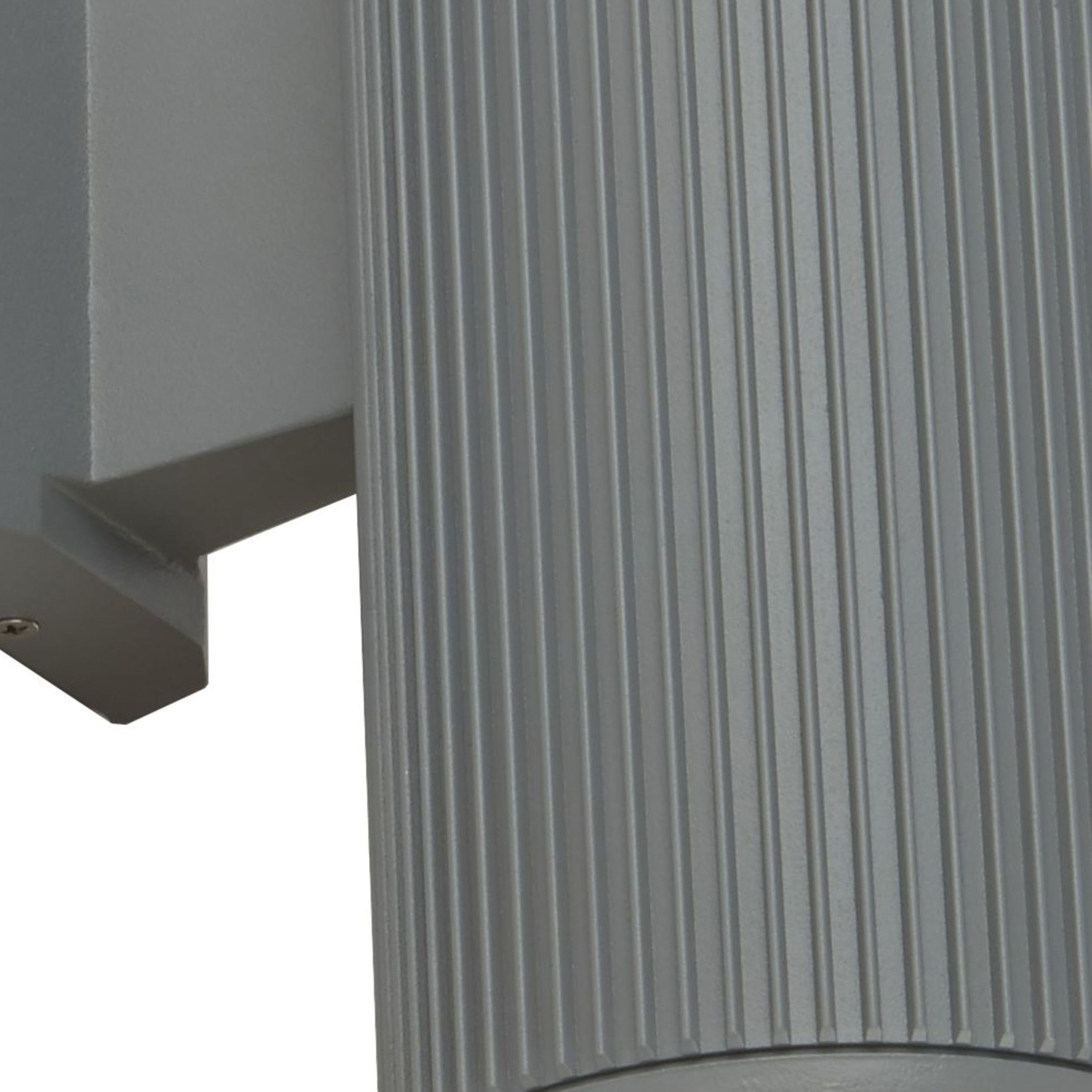 Close up of the Hamburg wall light's fluted grey body and wall mounting bracket with fixing screw.