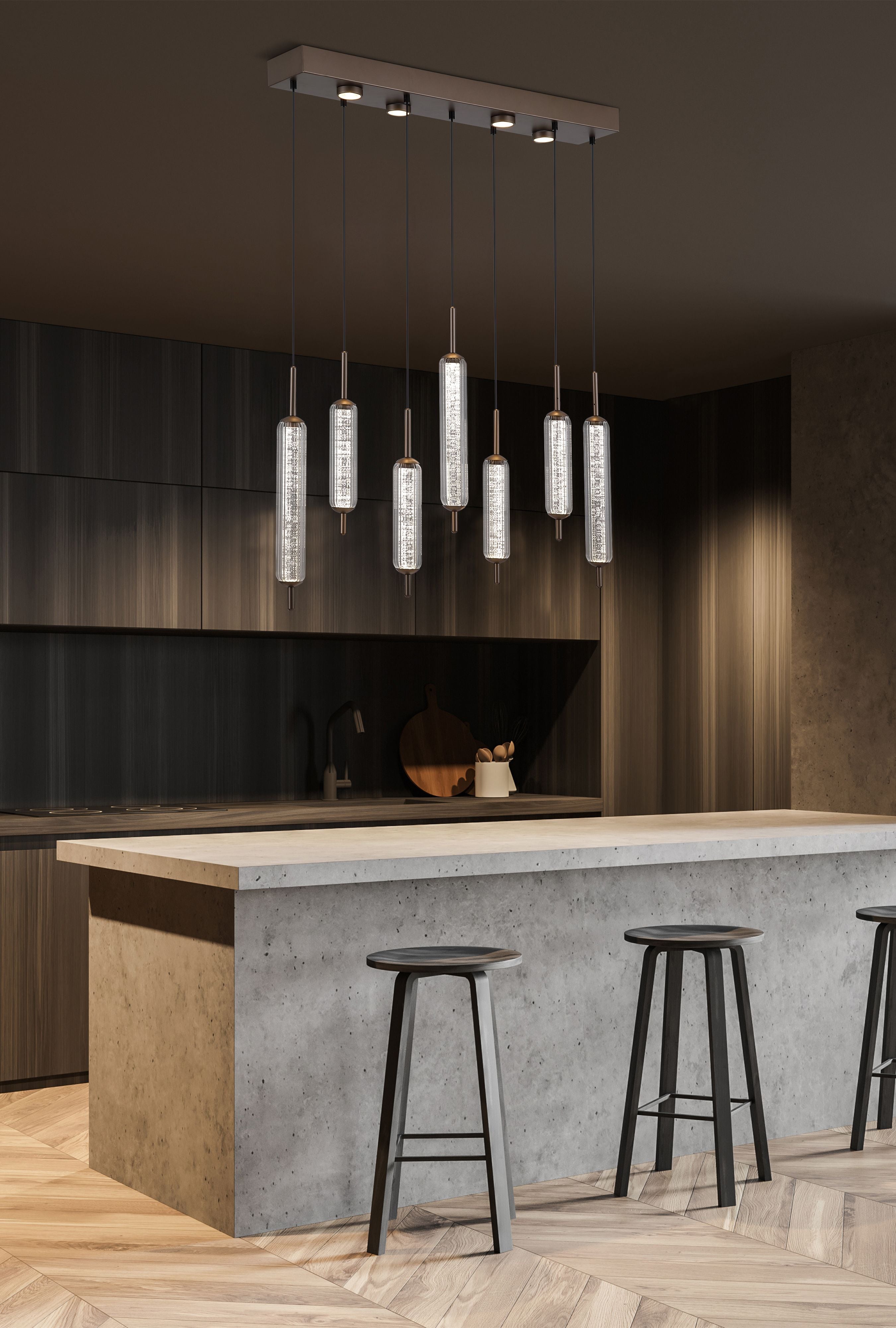 Searchlight Cattail 7 Light LED Pendant styled above a kitchen island with bar stools, shown lit in a dark toned modern kitchen