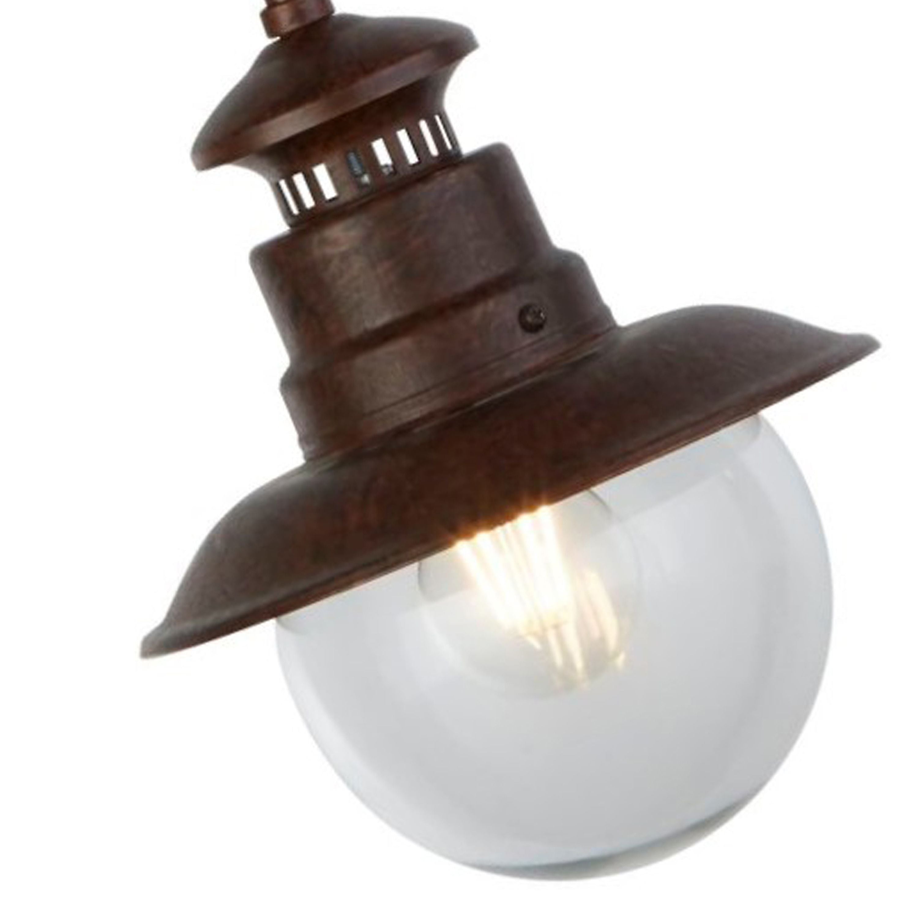 Close up of the Station outdoor pendant lantern head showing the rustic brown finish, vented collar and lit filament style bulb inside the clear glass globe