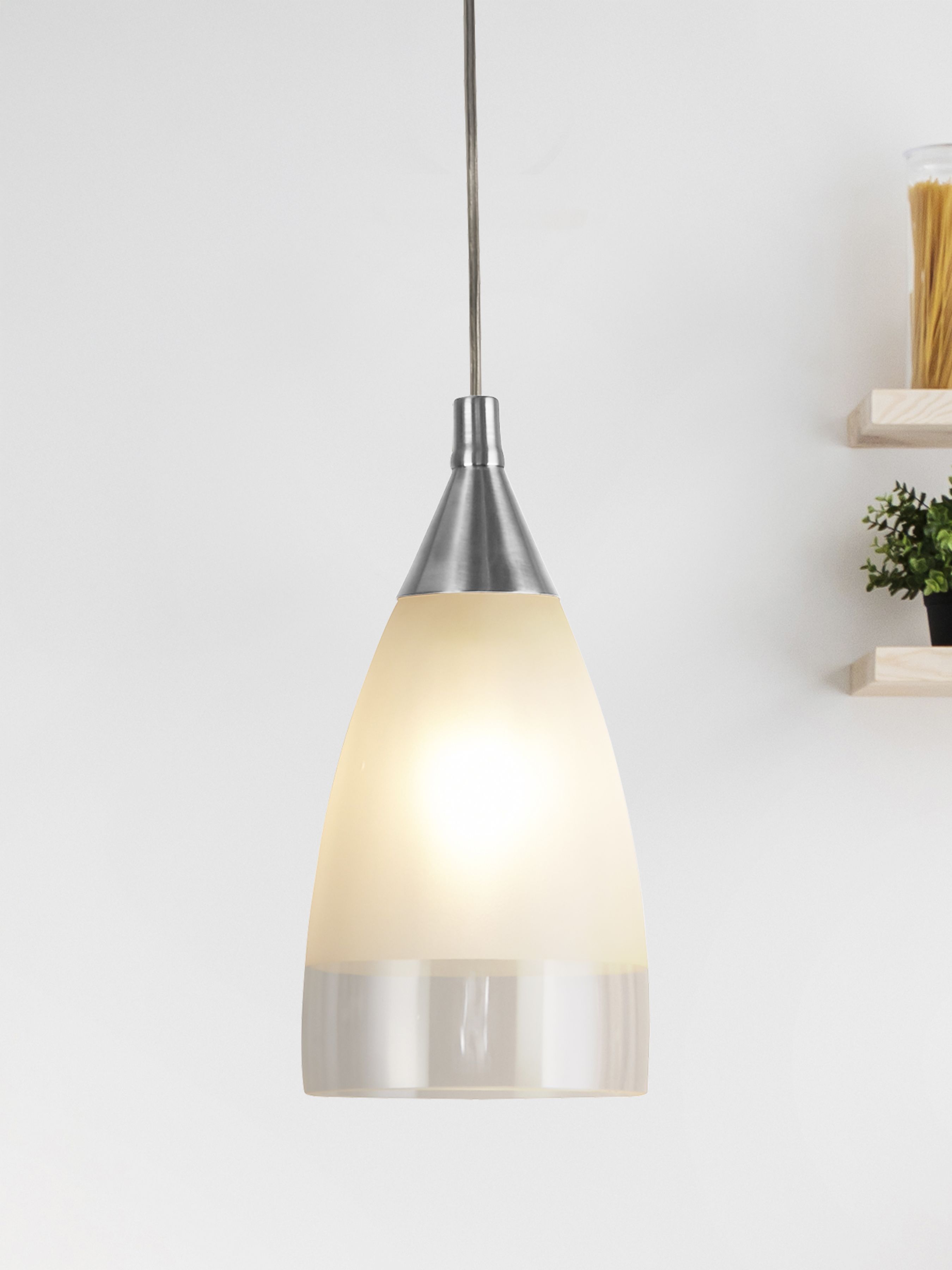 Searchlight Ankara pendant light lit and hanging in a styled kitchen beside open wooden shelving