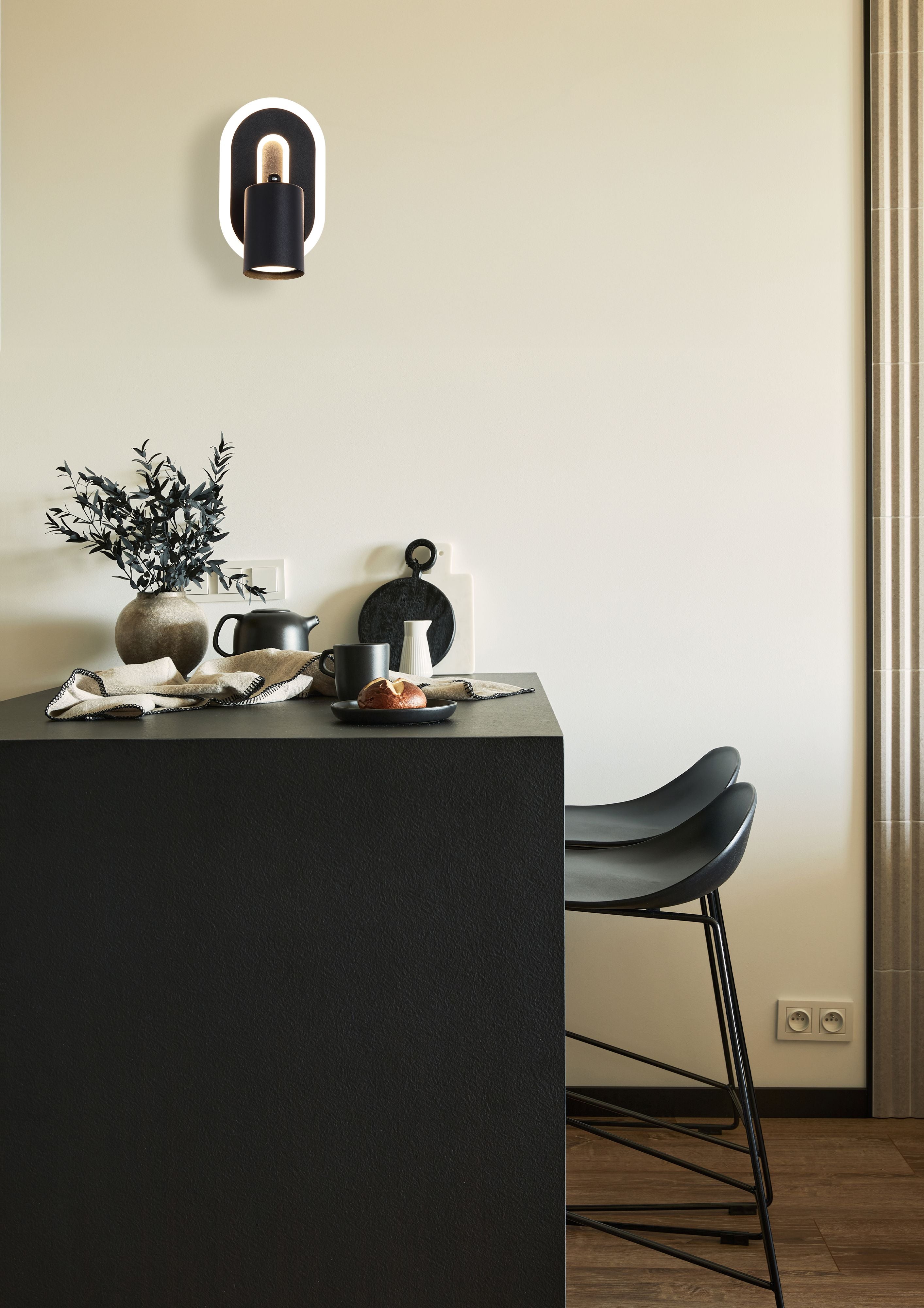 Searchlight San Diego wall light installed above a kitchen counter in a warm neutral toned kitchen