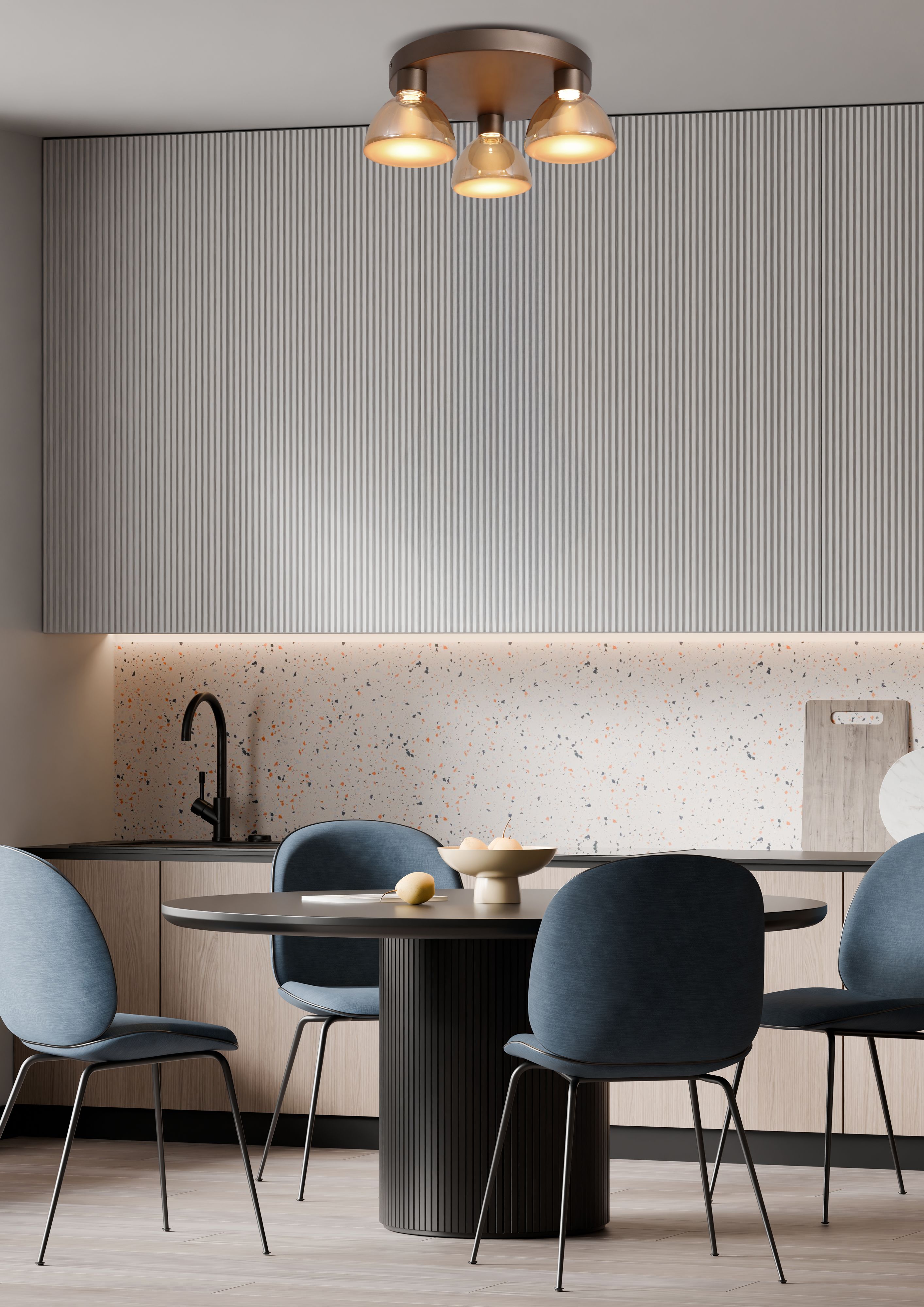 Searchlight Cannes LED 3 Light Flush styled above a round dining table in a kitchen with terrazzo effect splashback and blue upholstered chairs