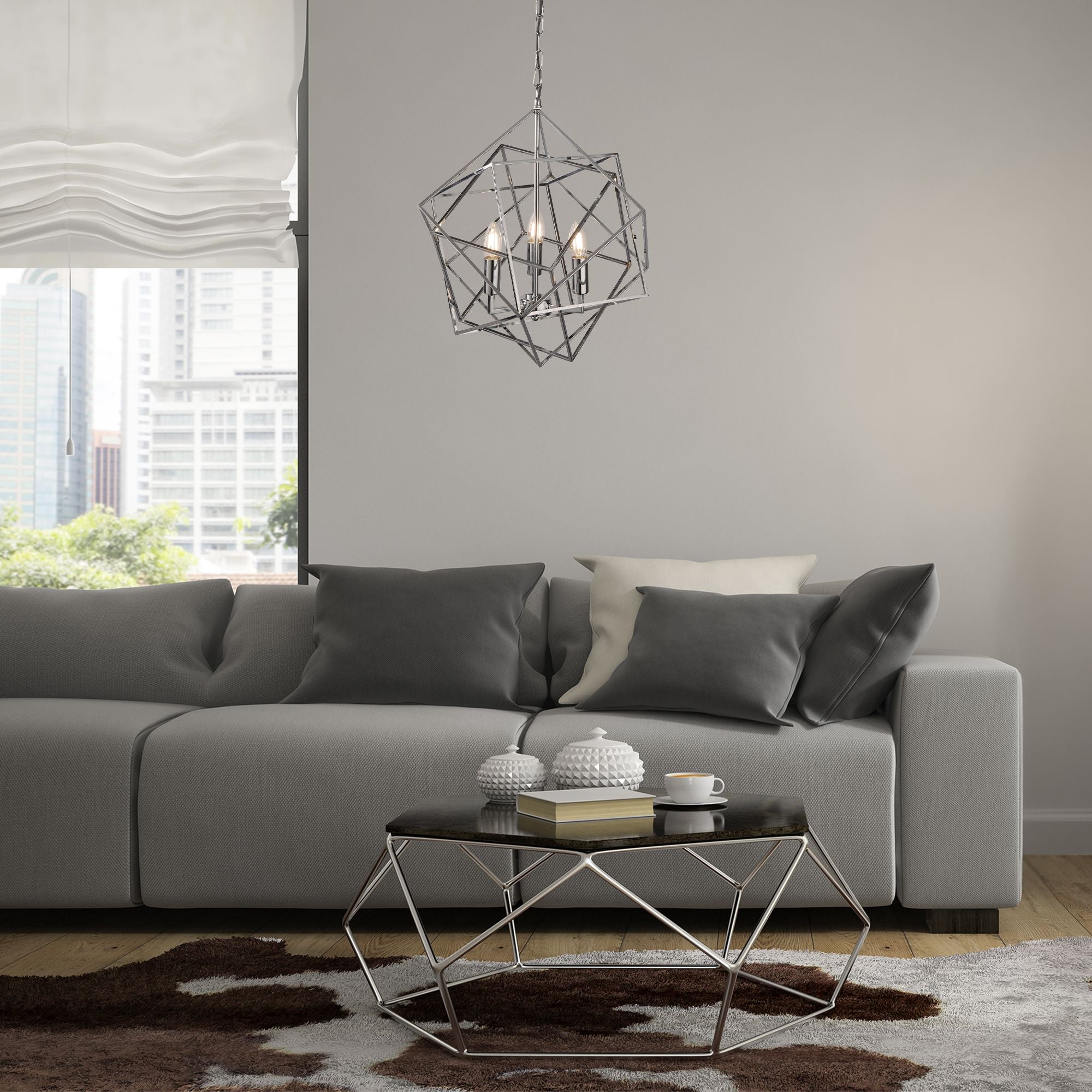 Cube pendant in polished chrome hanging above a geometric wire coffee table in a grey living room