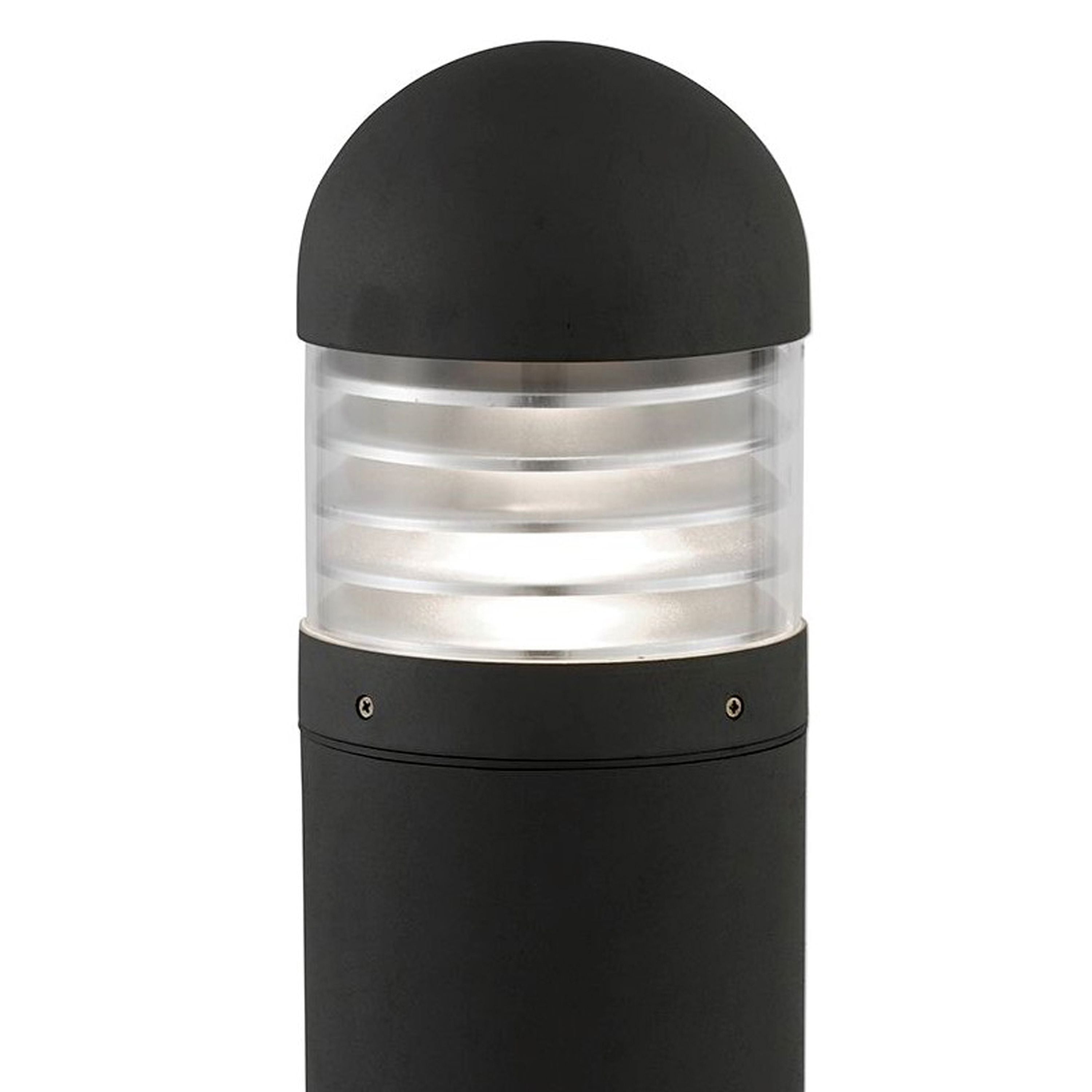 Close up of the Bronx outdoor post light head, showing the black domed cap and ribbed clear polycarbonate lens lit from inside