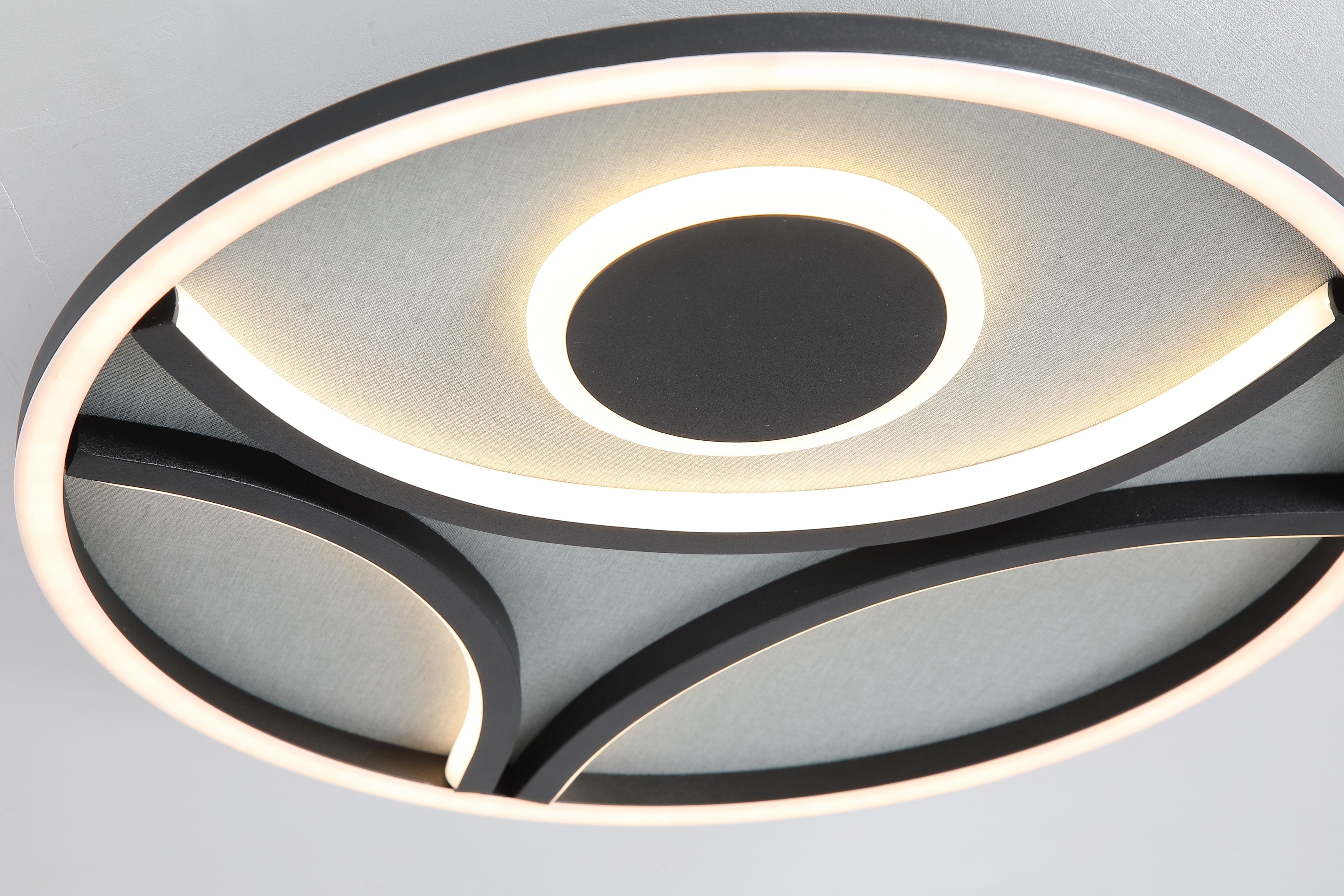 Close up of the Zendisc flush light fitted to a ceiling, showing the glowing central ring and dark centre disc