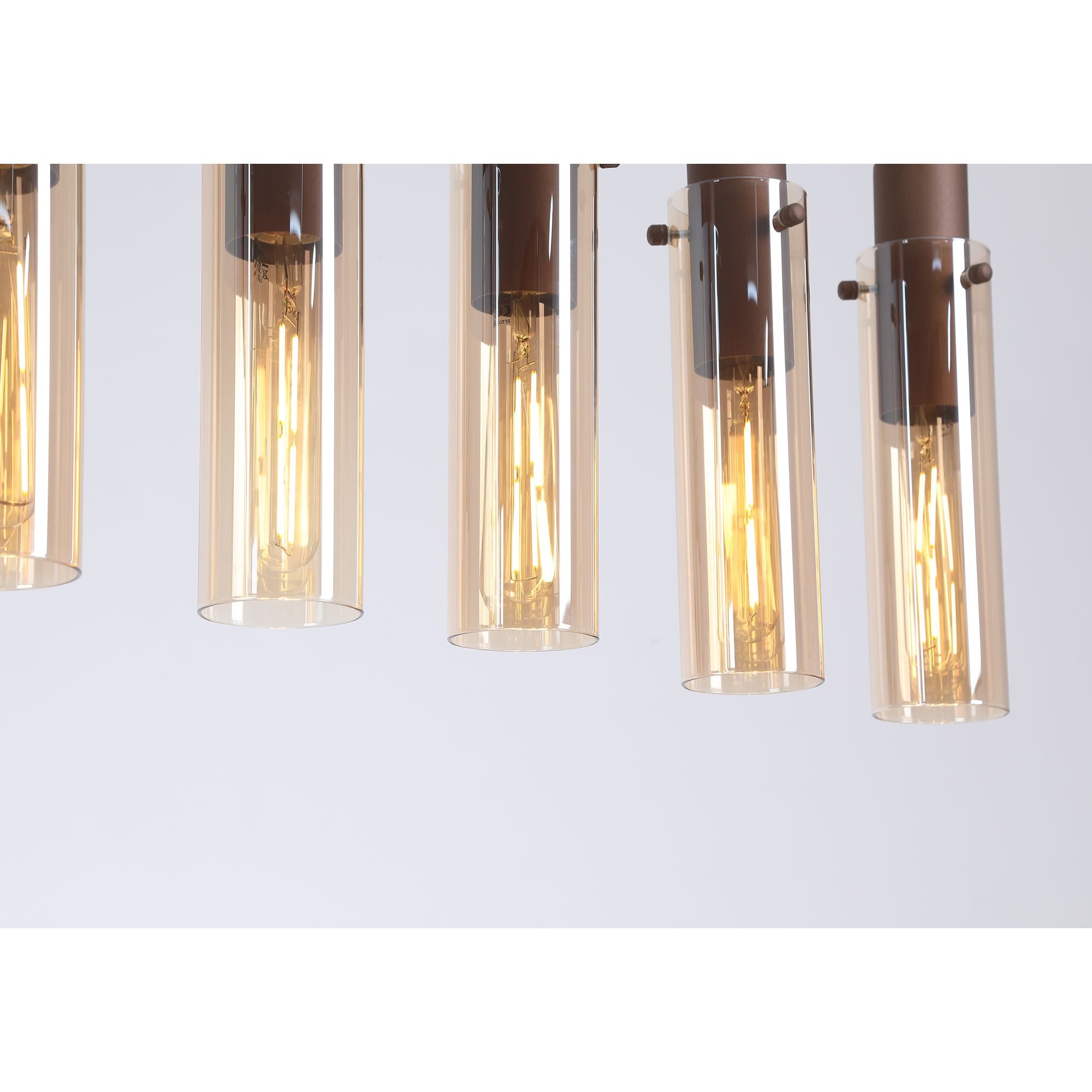 Close up of two amber glass shades on the Searchlight Sweden II 8 light bar pendant, showing the exposed filament style bulbs