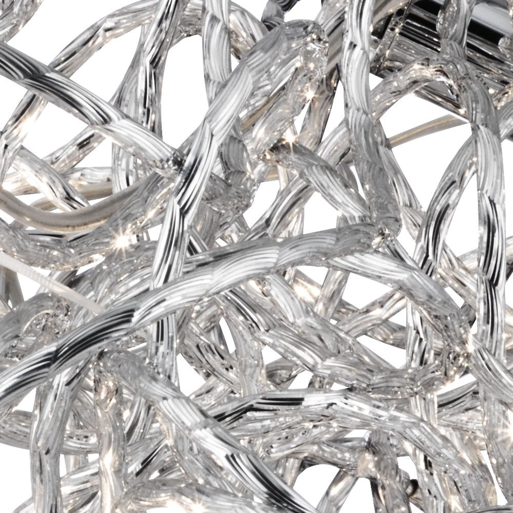 Close up of the Scribble pendant's tangled chrome aluminium tubing showing the diamond cut texture and reflective finish