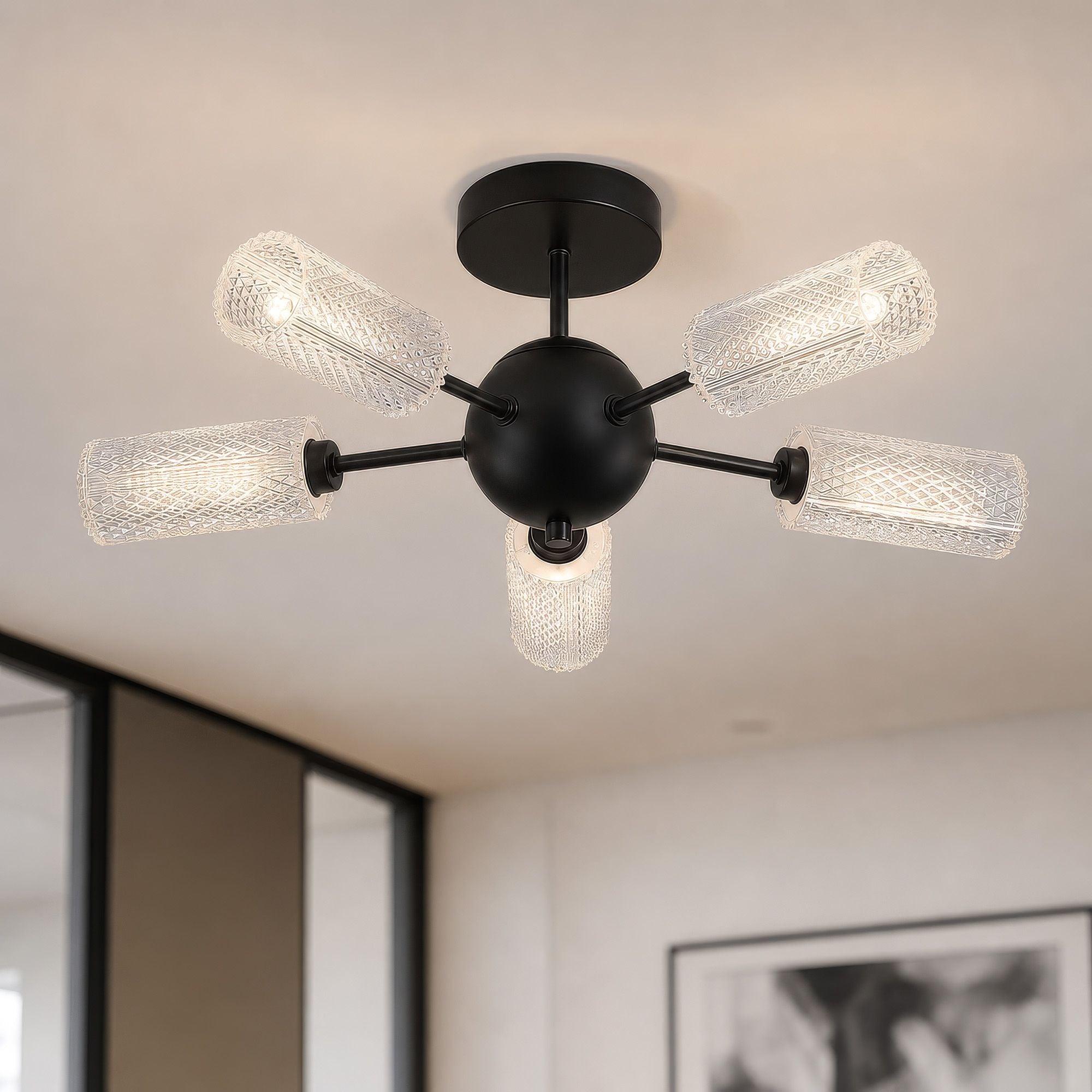 Searchlight Cosmic 5 light semi flush ceiling light styled in a bright room with tall windows and large framed artwork on the wall