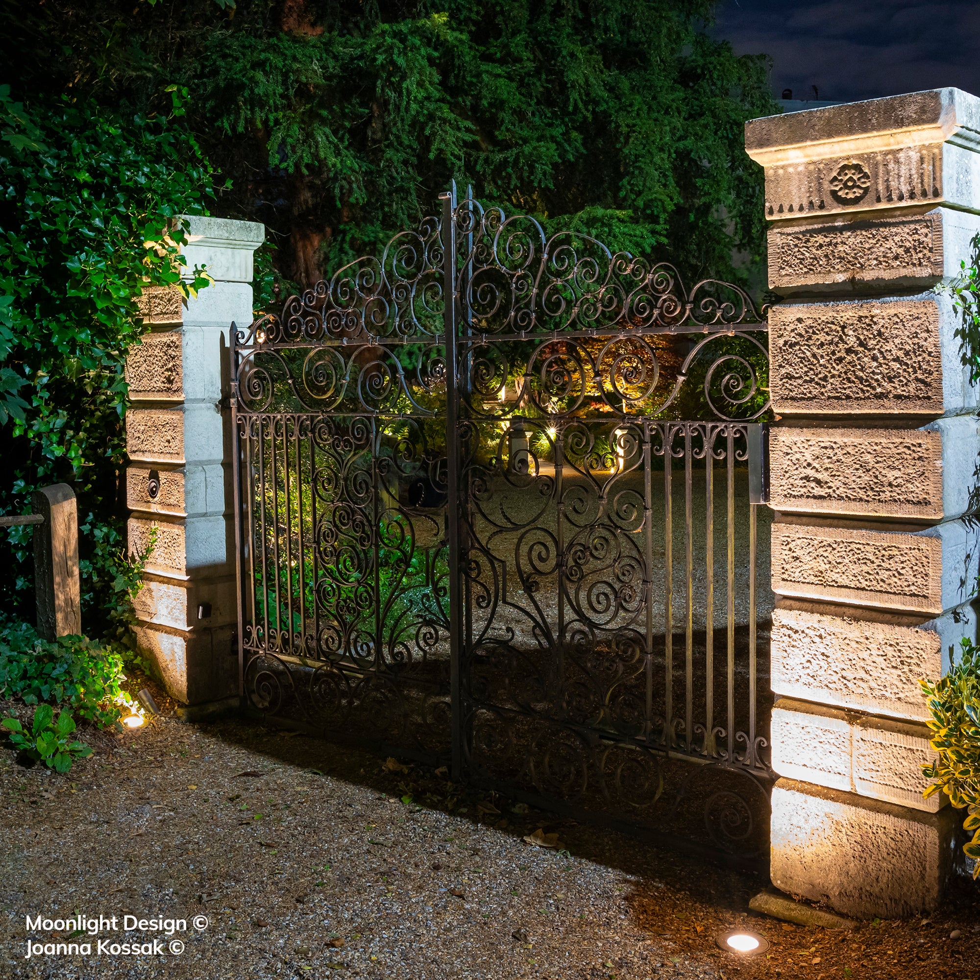 Hunza Driveway Light installed flush in driveway at night - Moonlight Design garden lighting project