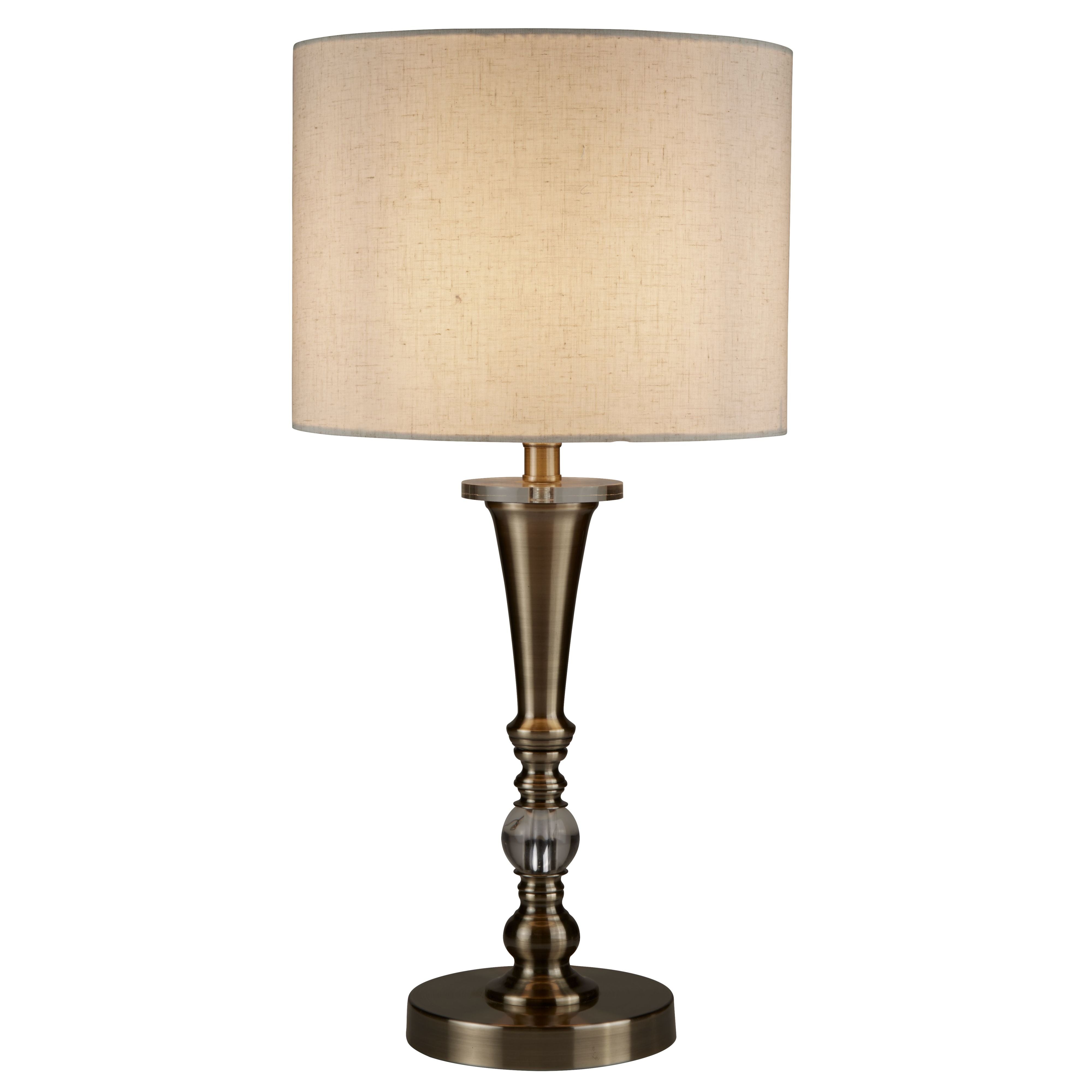 Searchlight Oscar table lamp in antique brass with an oatmeal linen shade, front view on a white background