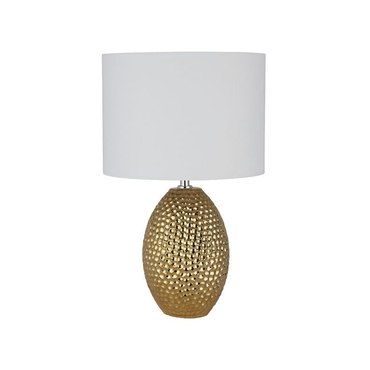Searchlight Nadine table lamp with dimpled gold ceramic style base and cream fabric shade, close cropped studio shot on a white background