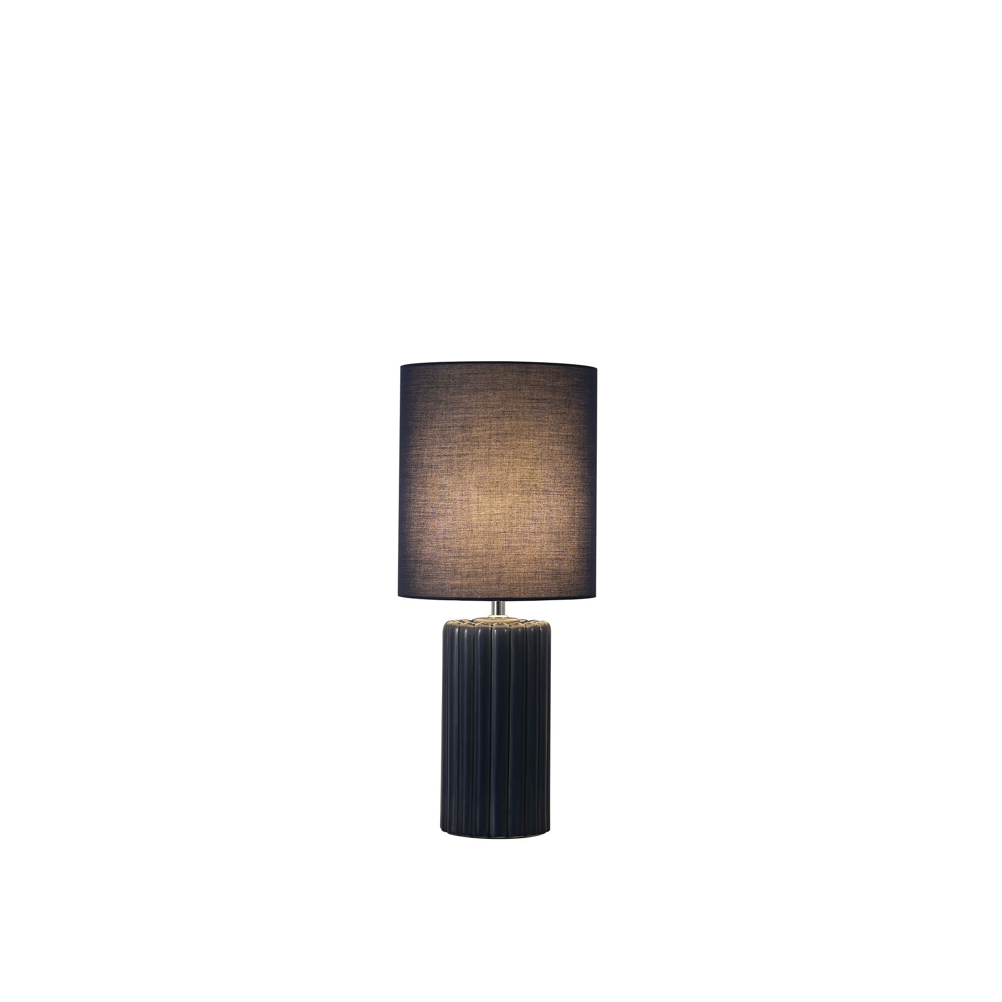 Searchlight Groove table lamp in navy blue, ribbed ceramic base with matching navy fabric drum shade, studio shot with the lamp lit