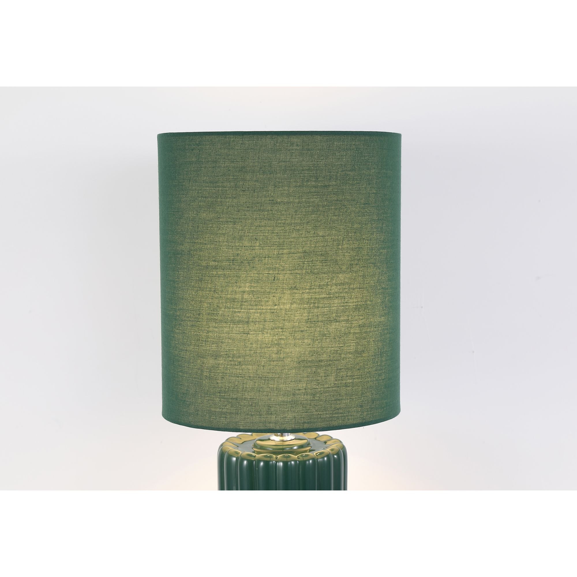 Close up of the Groove olive green table lamp, showing the fluted ceramic neck and where the fabric drum shade meets the fitting