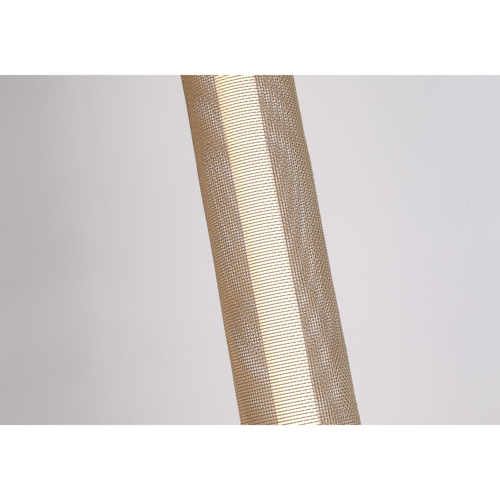Close up of the gold mesh weave on the Thread LED floor lamp shade, lit from within