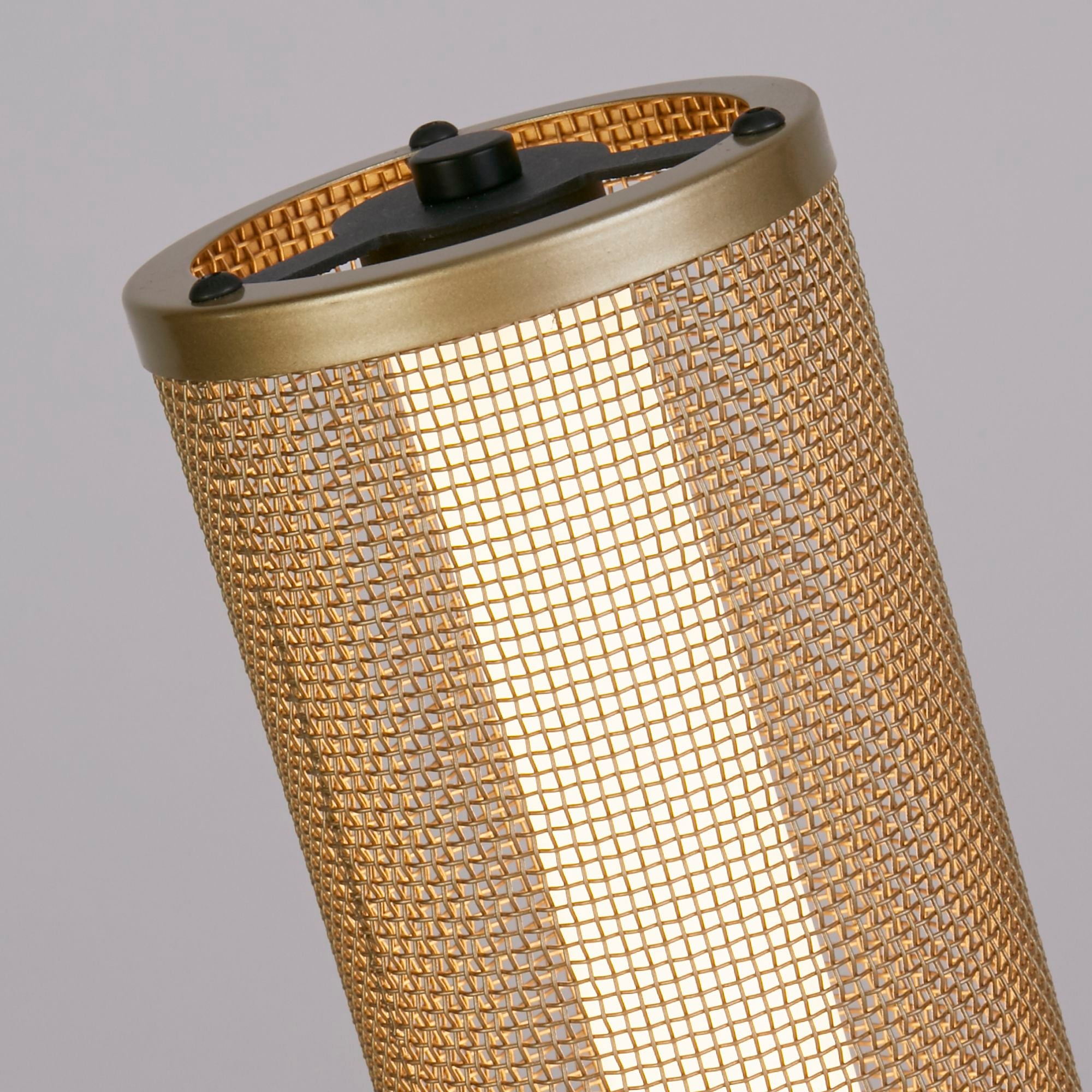 Close up of the top rim and touch dimmer control on the Thread LED table lamp, mesh shade lit from within