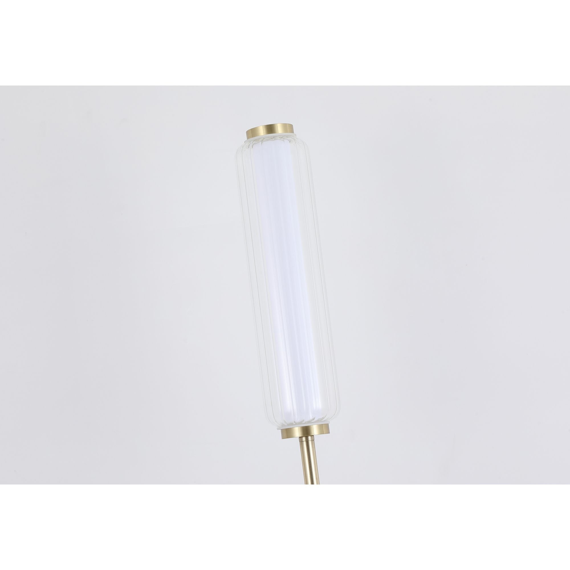Close up angled view of the top of the Searchlight Mod LED Floor Lamp showing the lit ribbed glass column and brass cap