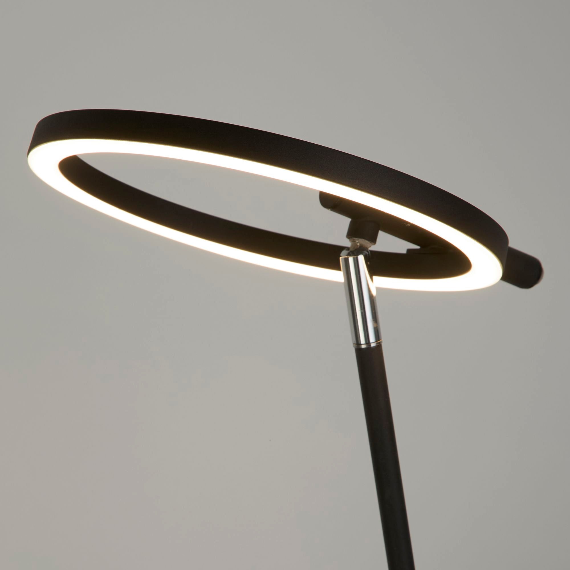 Close up of the Space table lamp's ring head and chrome jointed arm, showing how the head pivots and tilts