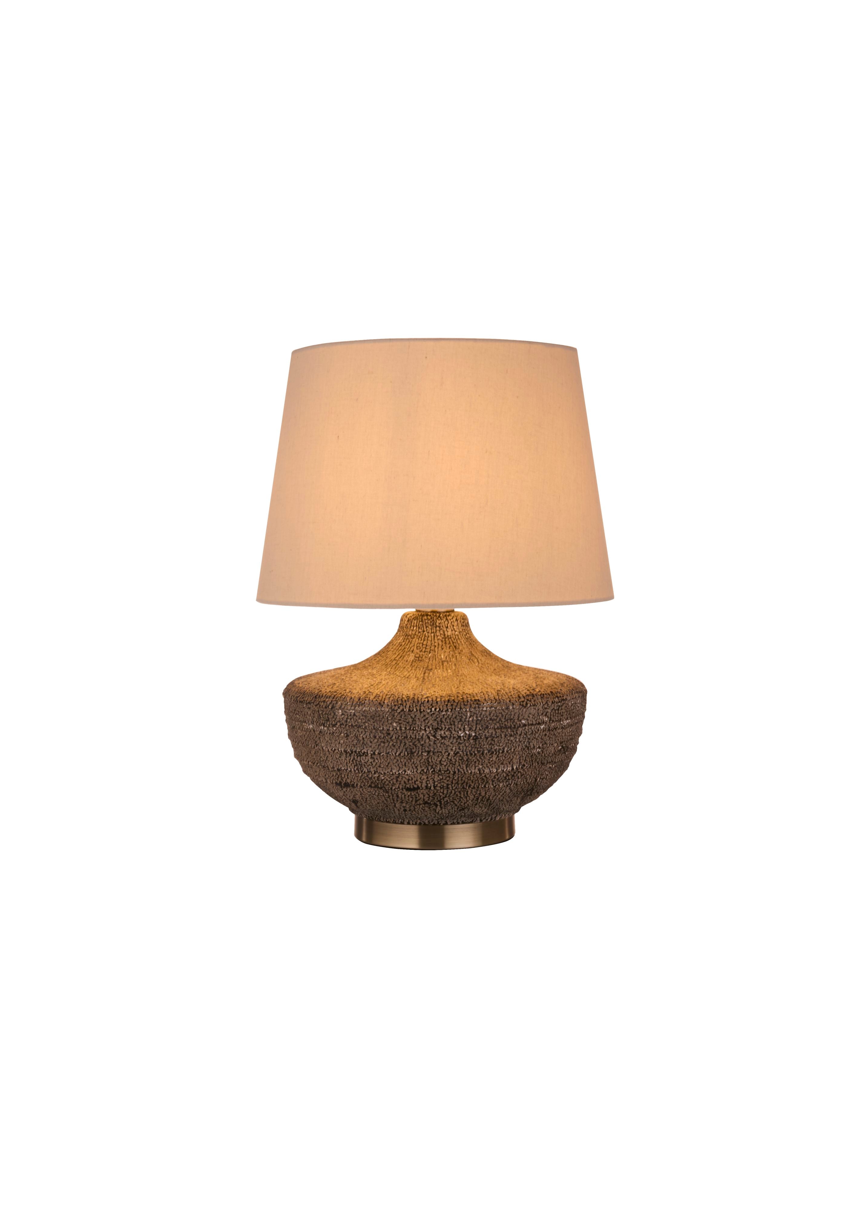 Searchlight Avaya table lamp with a ribbed ceramic base in gold and grey ombre tones, topped with a beige linen tapered shade, studio shot on a white background
