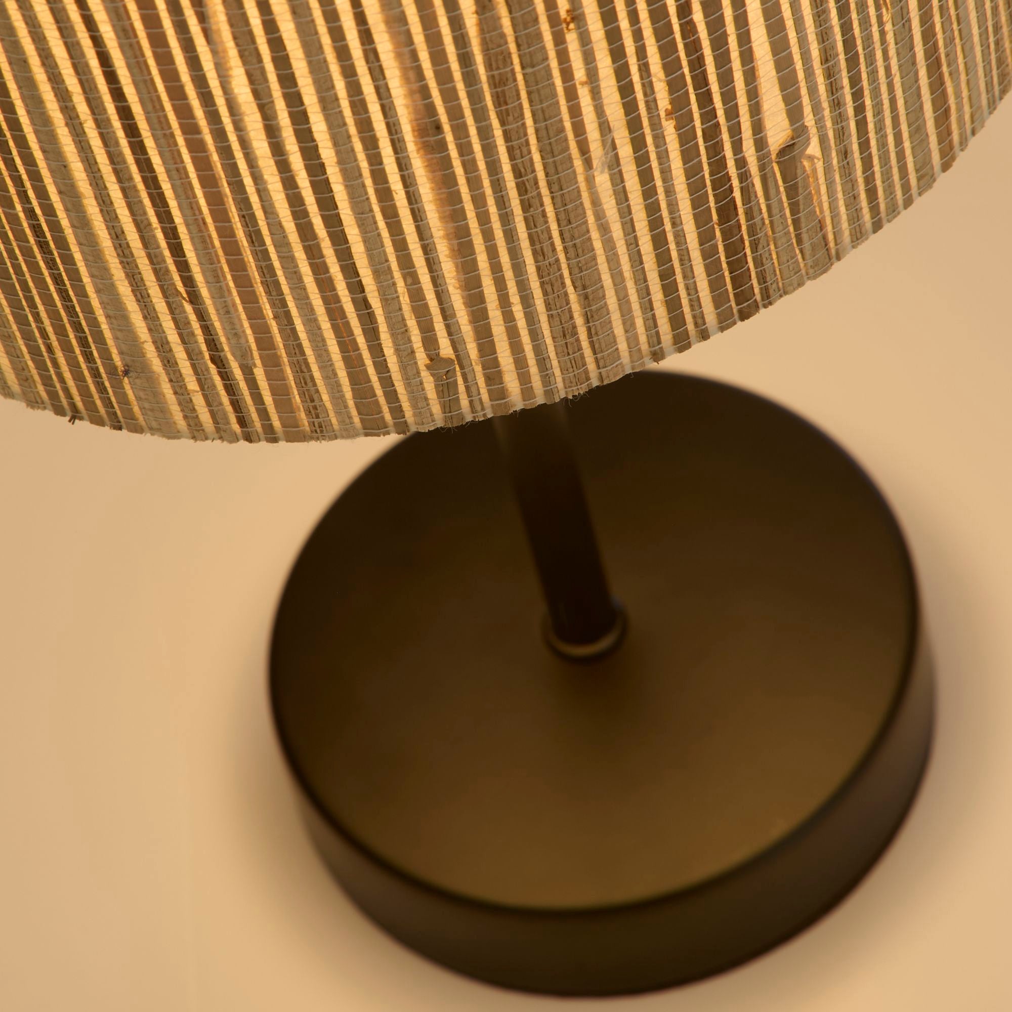 Close up looking up into the Searchlight Meadow table lamp shade, showing the black base and stem