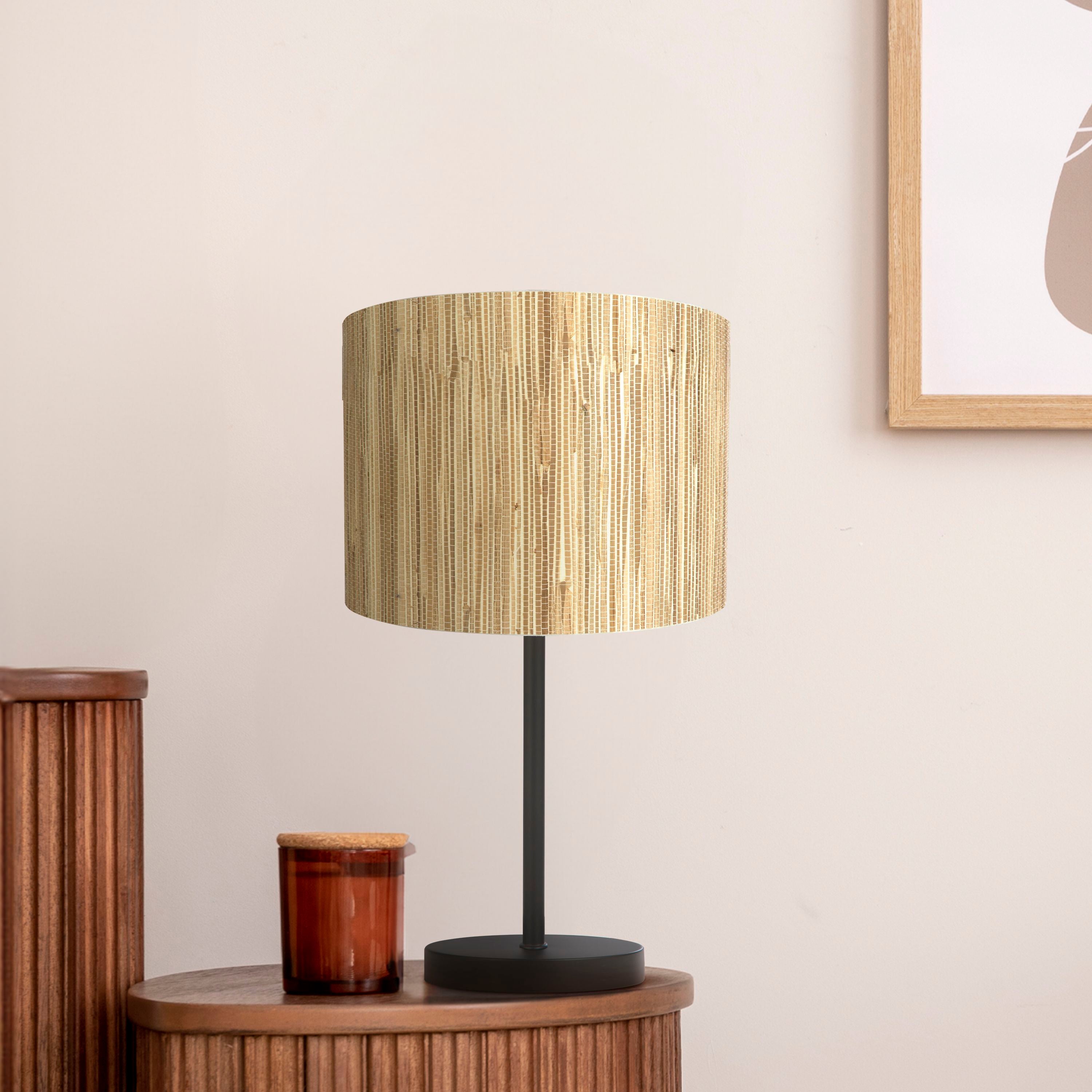 Searchlight Meadow table lamp styled on a wooden sideboard beside a candle jar and framed artwork