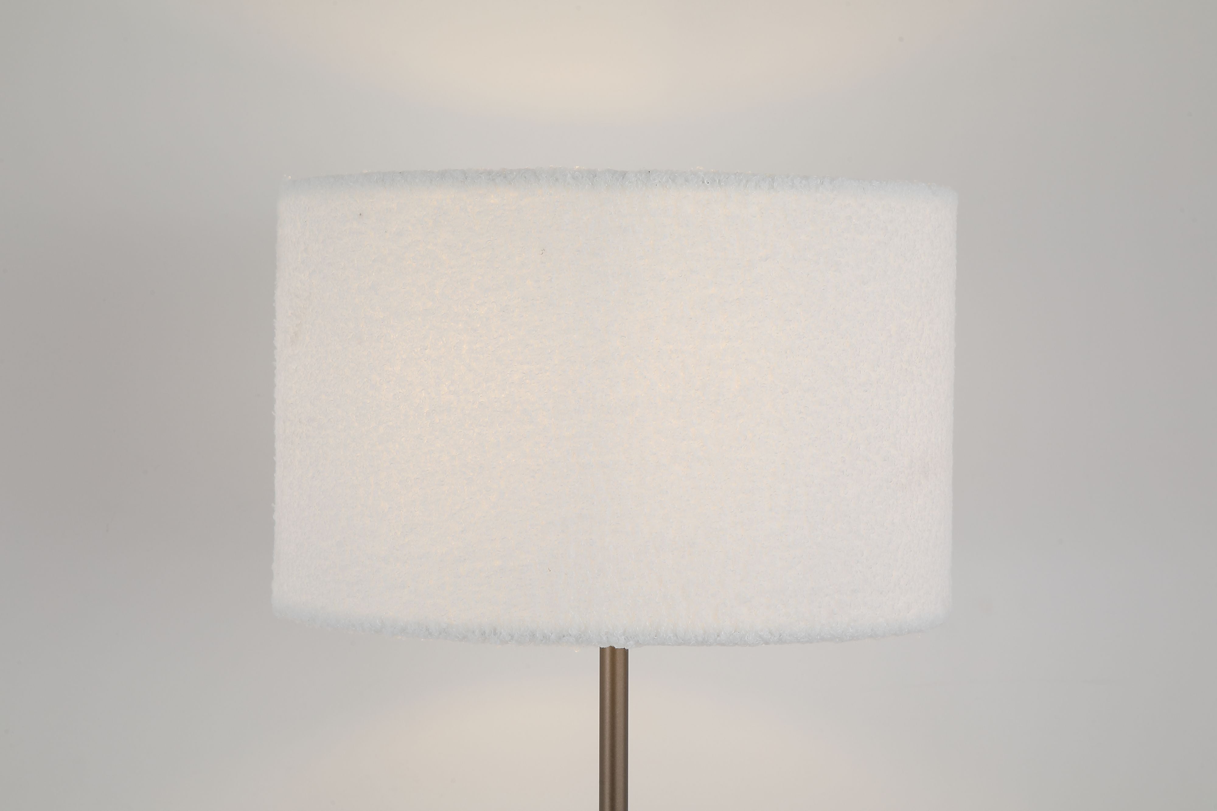 Close up of the Chelsea floor lamp's cream boucle shade, showing the looped fabric texture