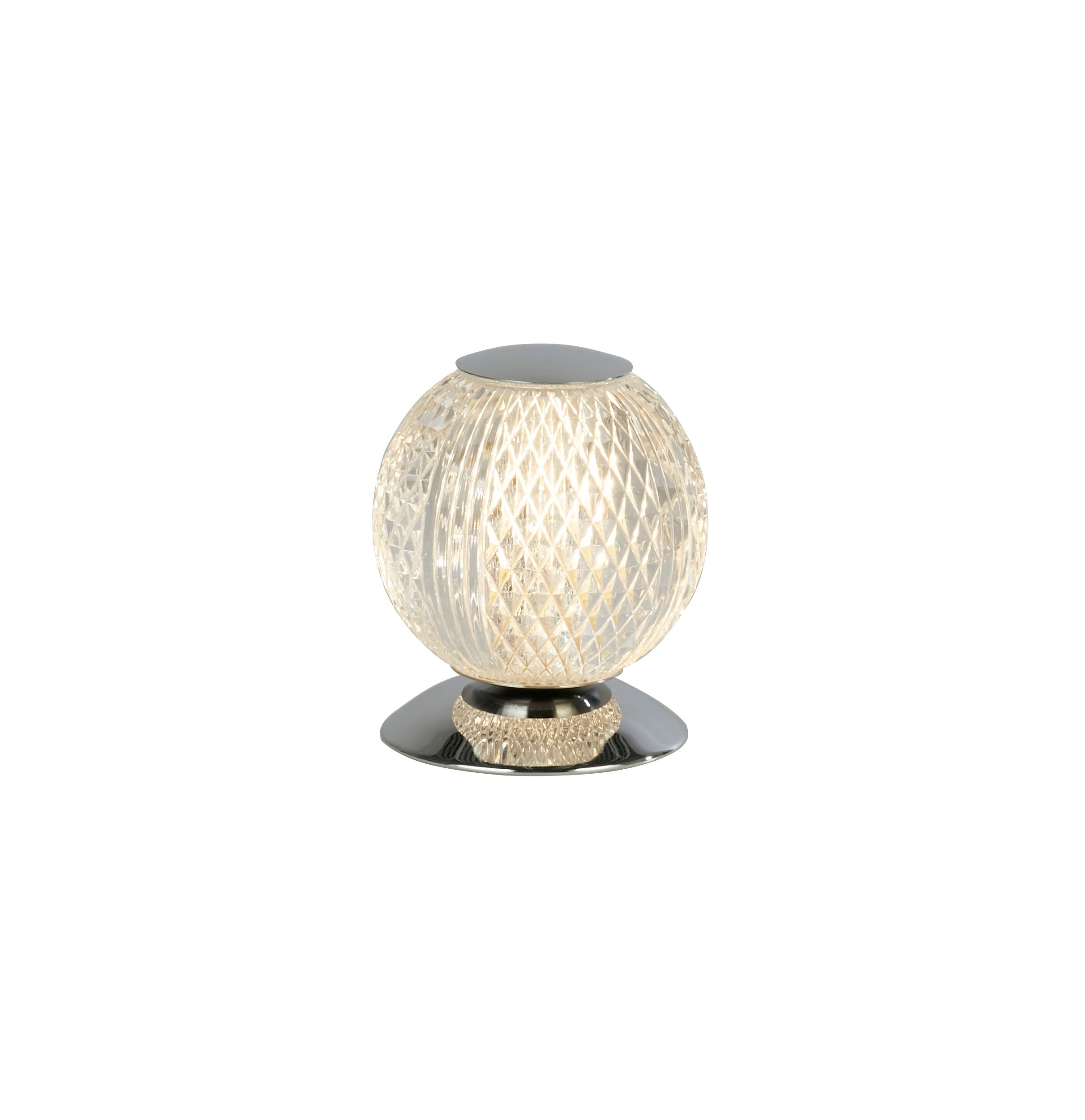 Searchlight Allure table lamp in chrome, faceted acrylic globe shade glowing warm white against a plain white background