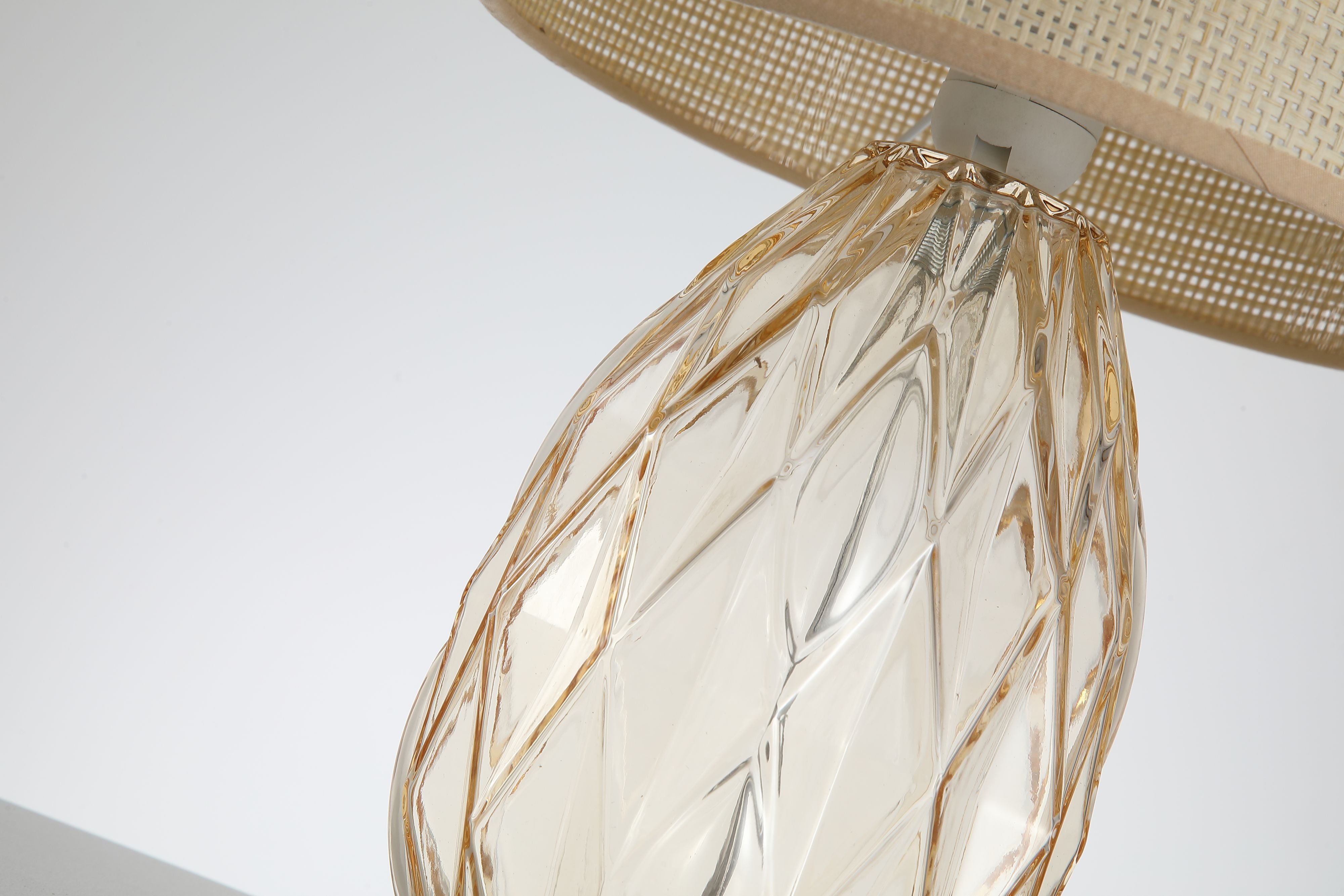 Close up of the Diane table lamp base showing the cut diamond facet texture of the champagne glass