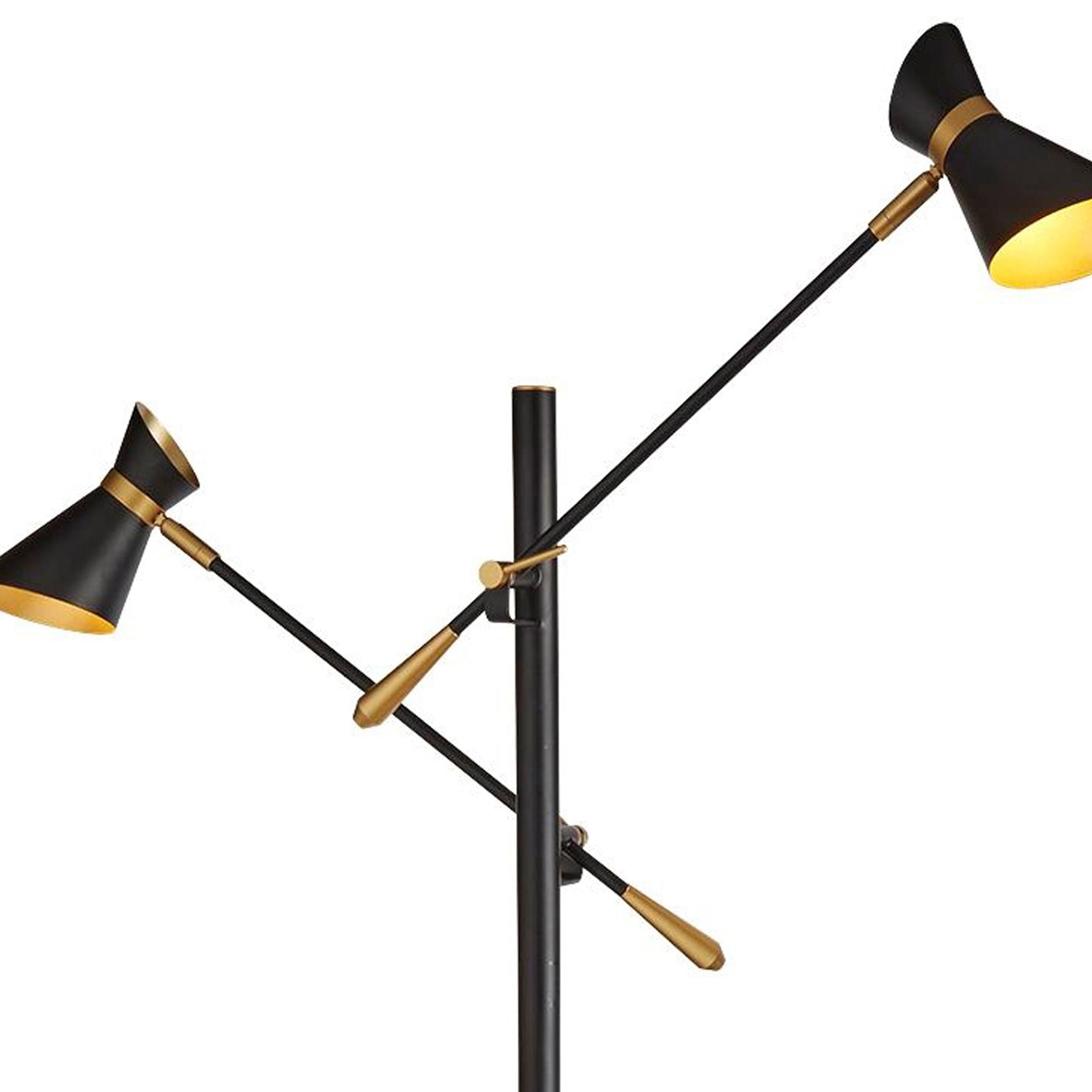 Close up of the Searchlight Diablo floor lamp heads, showing the black cone shades with brass trim and gold lined interior