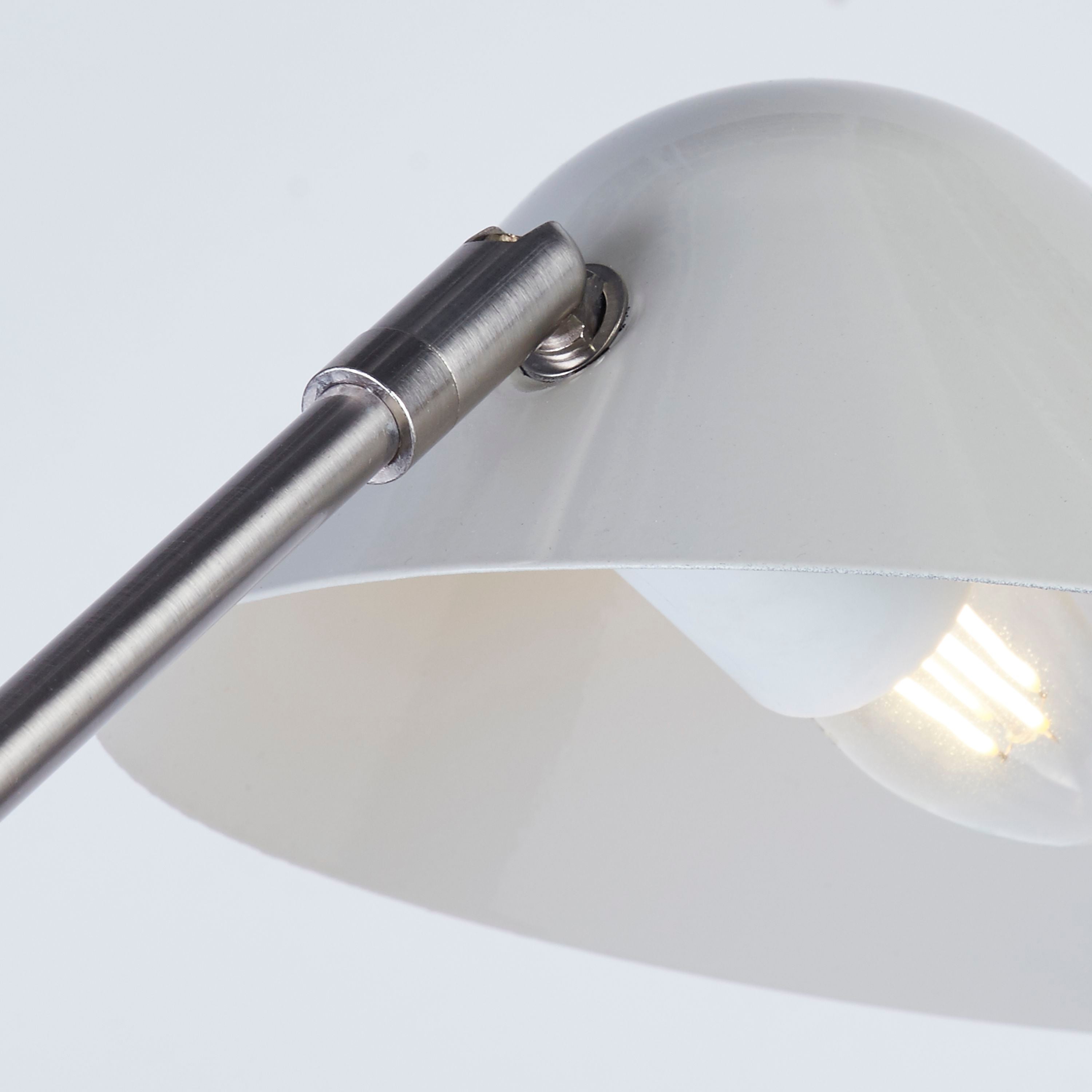 Close up underneath the Swan Floor Lamp shade showing the chrome fitting and illuminated bulb