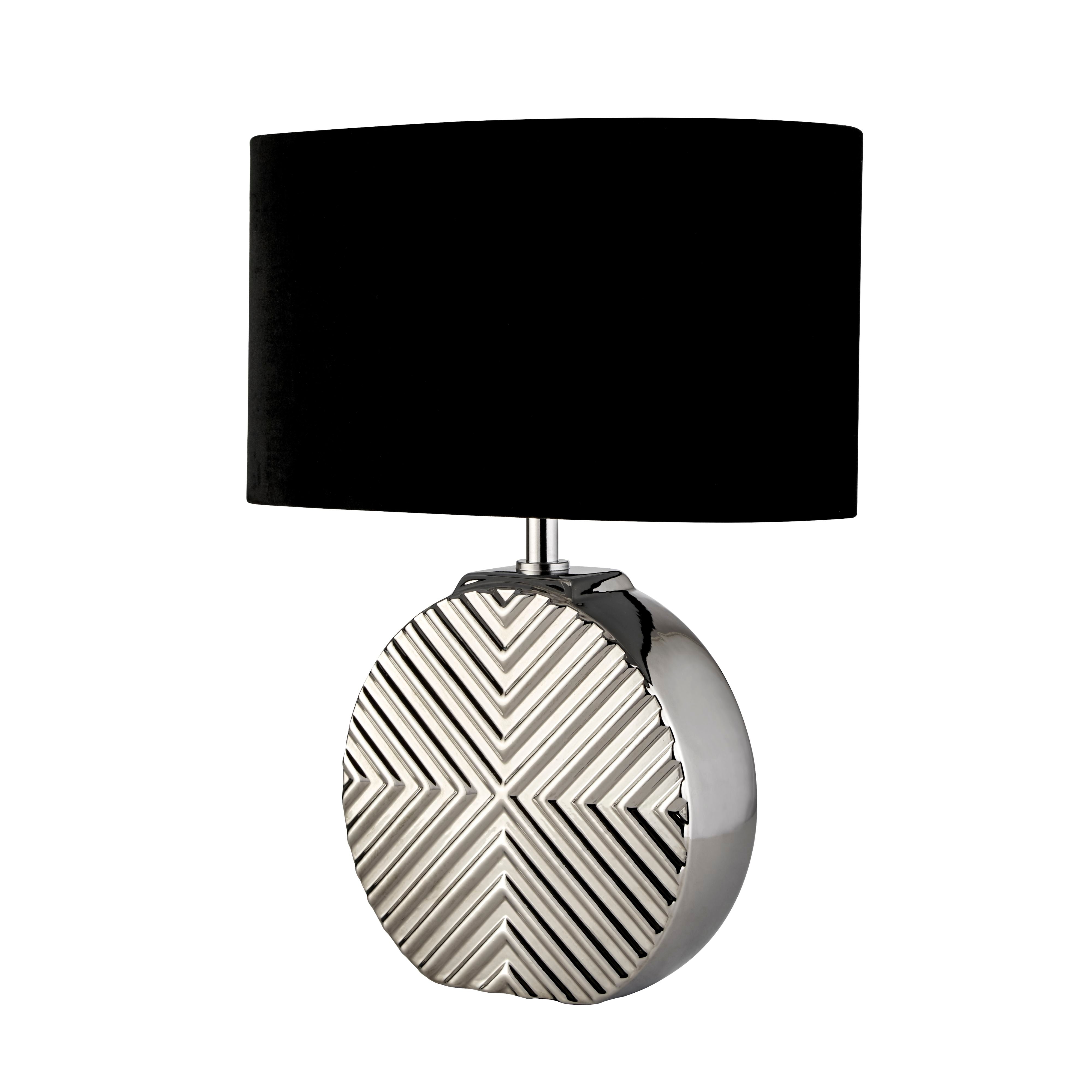 Searchlight Regen table lamp with chrome ceramic chevron textured base and black oval fabric shade, straight on studio shot on a white background