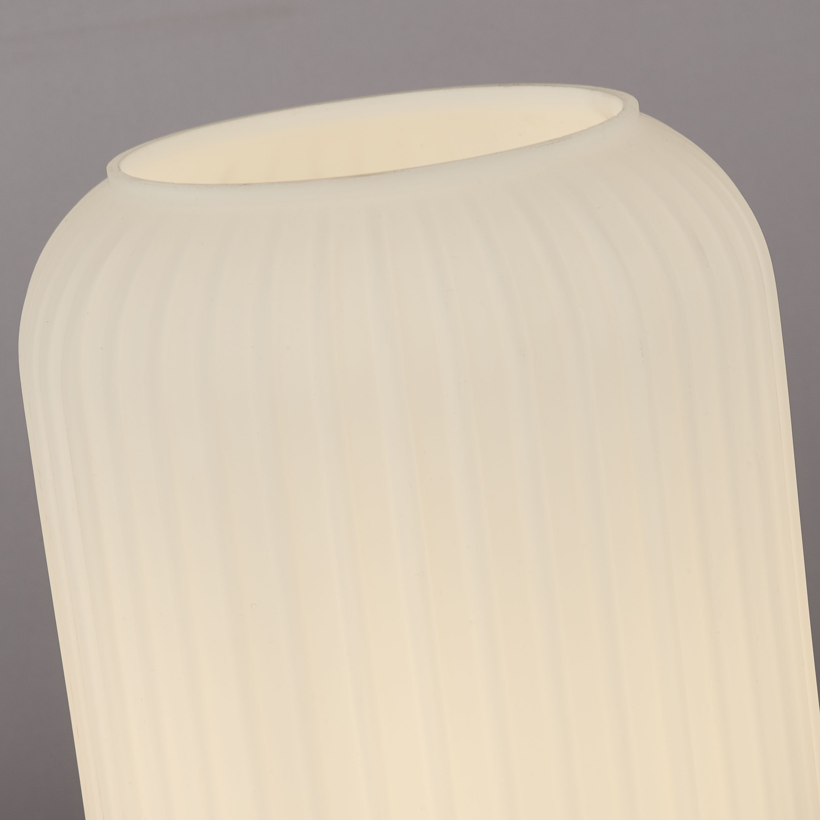 Close up of the frosted ribbed glass shade on the Searchlight Pearl table lamp, showing the top opening