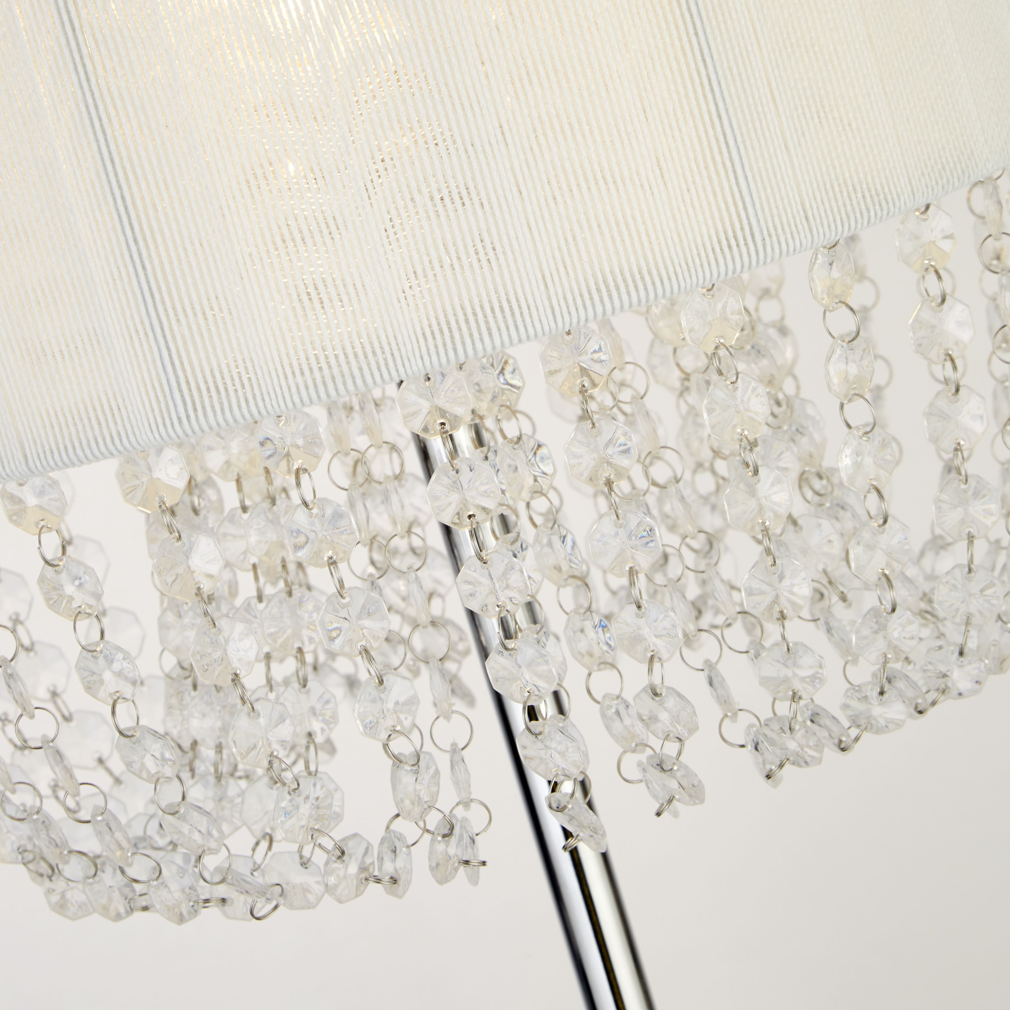 Close up of the white pleated shade and cascading clear acrylic beads on the Bellano floor lamp
