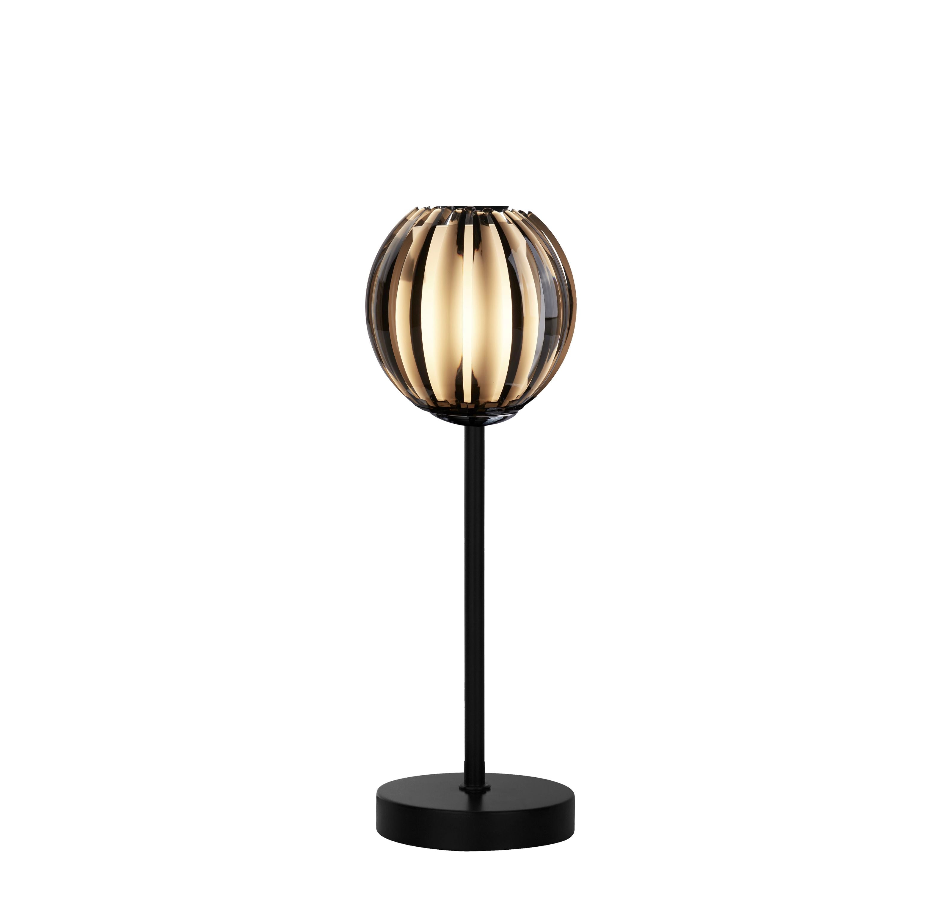 Searchlight Blossom table lamp with black metal stem and smoked acrylic globe shade, lit, studio shot on a white background