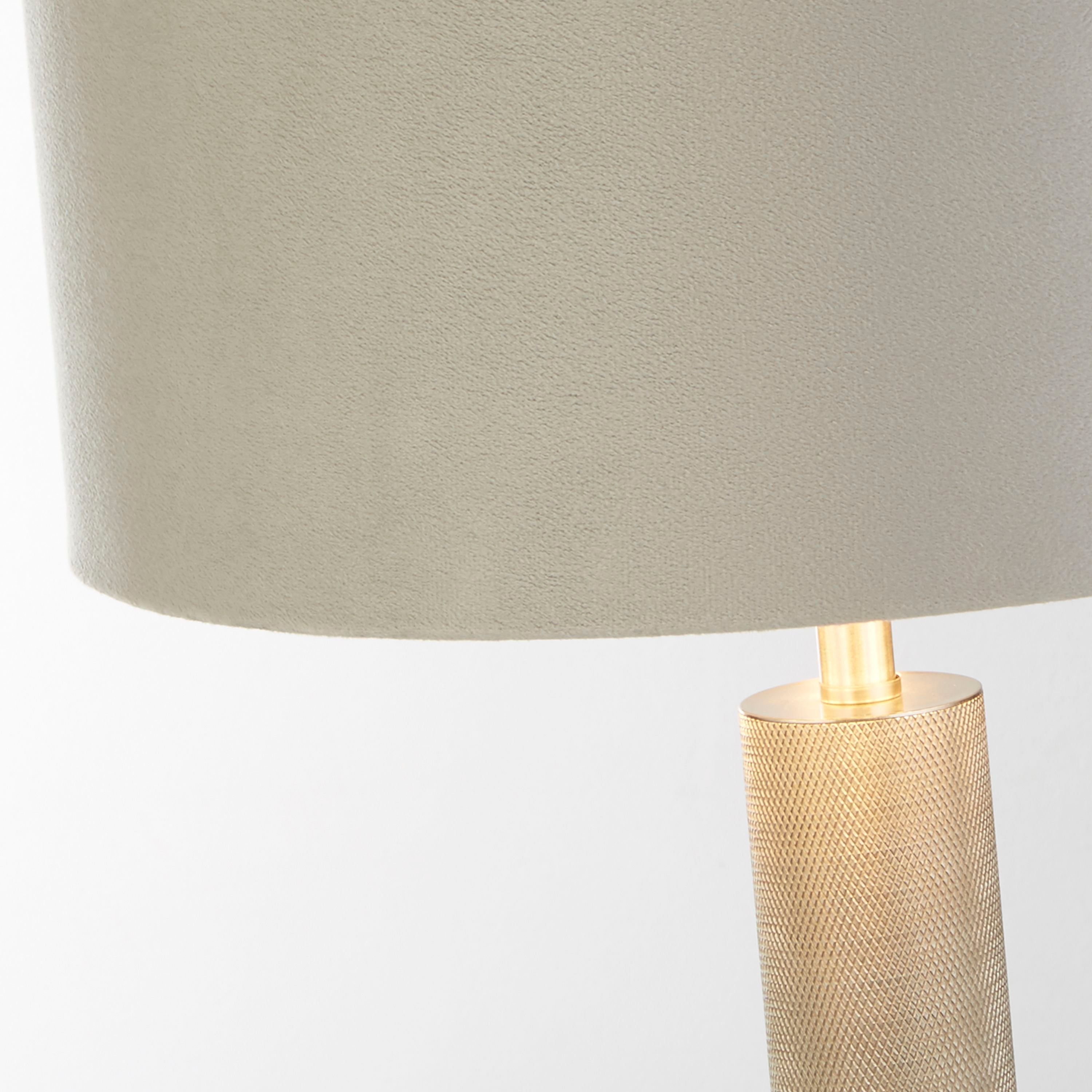 Close up of the London table lamp's grey velvet shade edge meeting the knurled metal column, showing the texture of the knurling and the shade's metallic lining