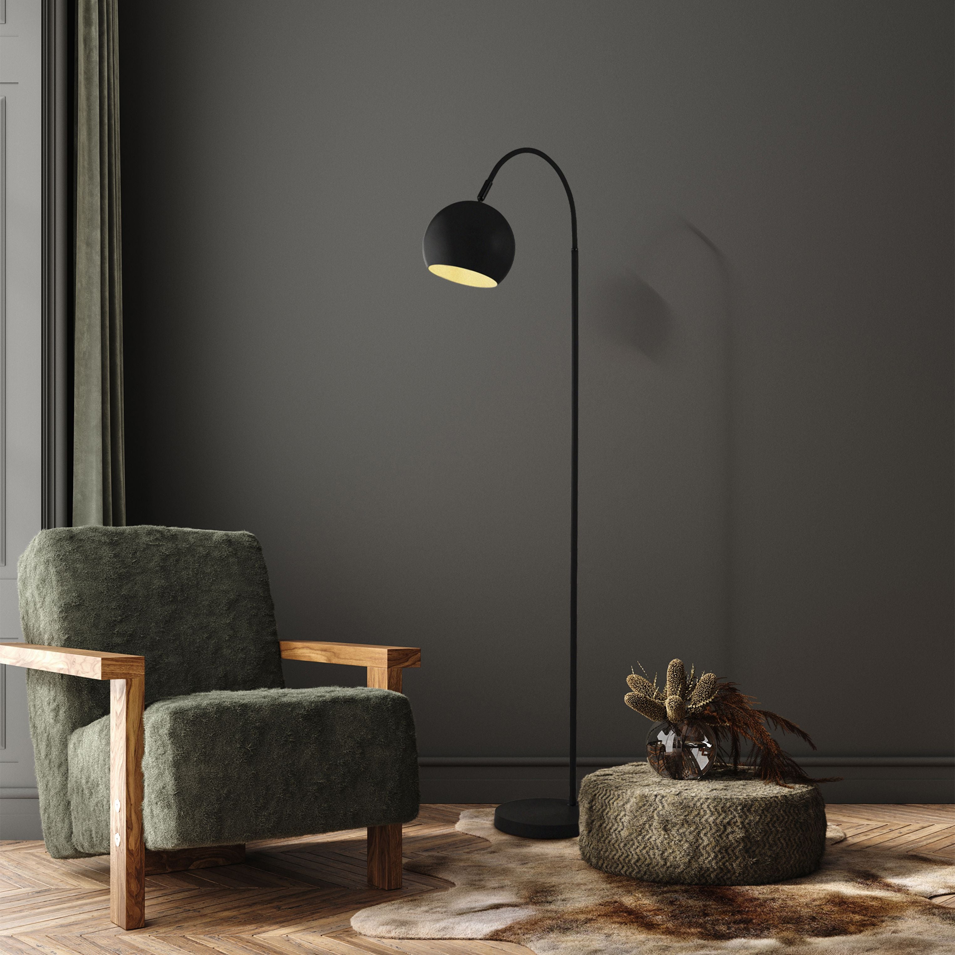 Searchlight Calumn Floor Lamp styled beside a green armchair and pouf with a vase of dried flowers