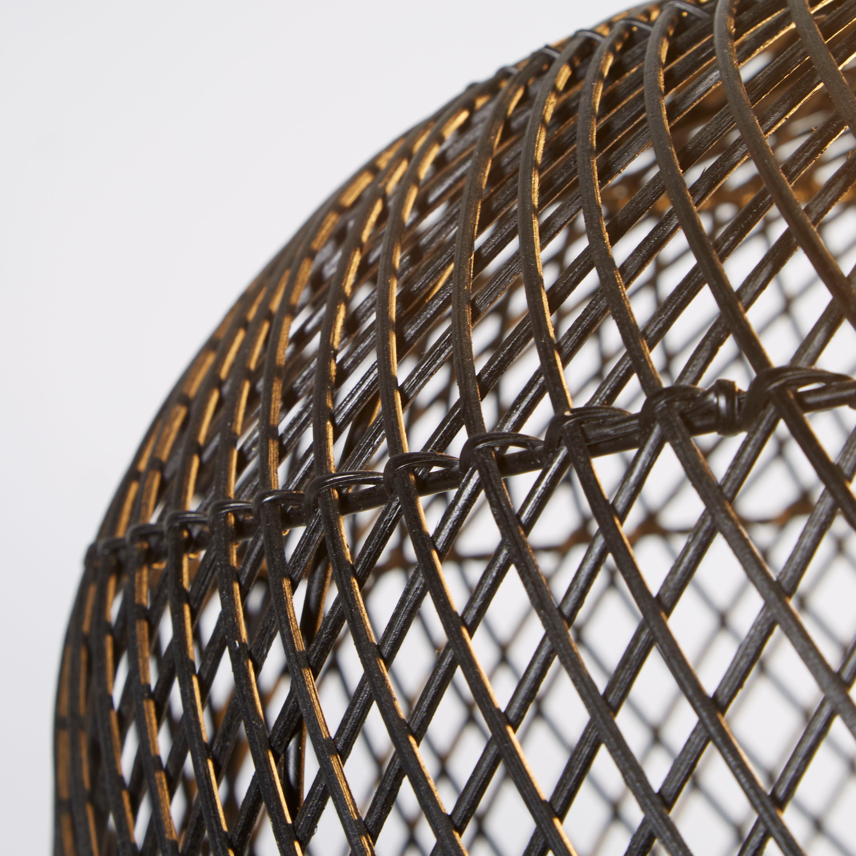 Close up of the black rattan lattice weave on the large bell pendant shade, showing the natural cane tone beneath the black finish