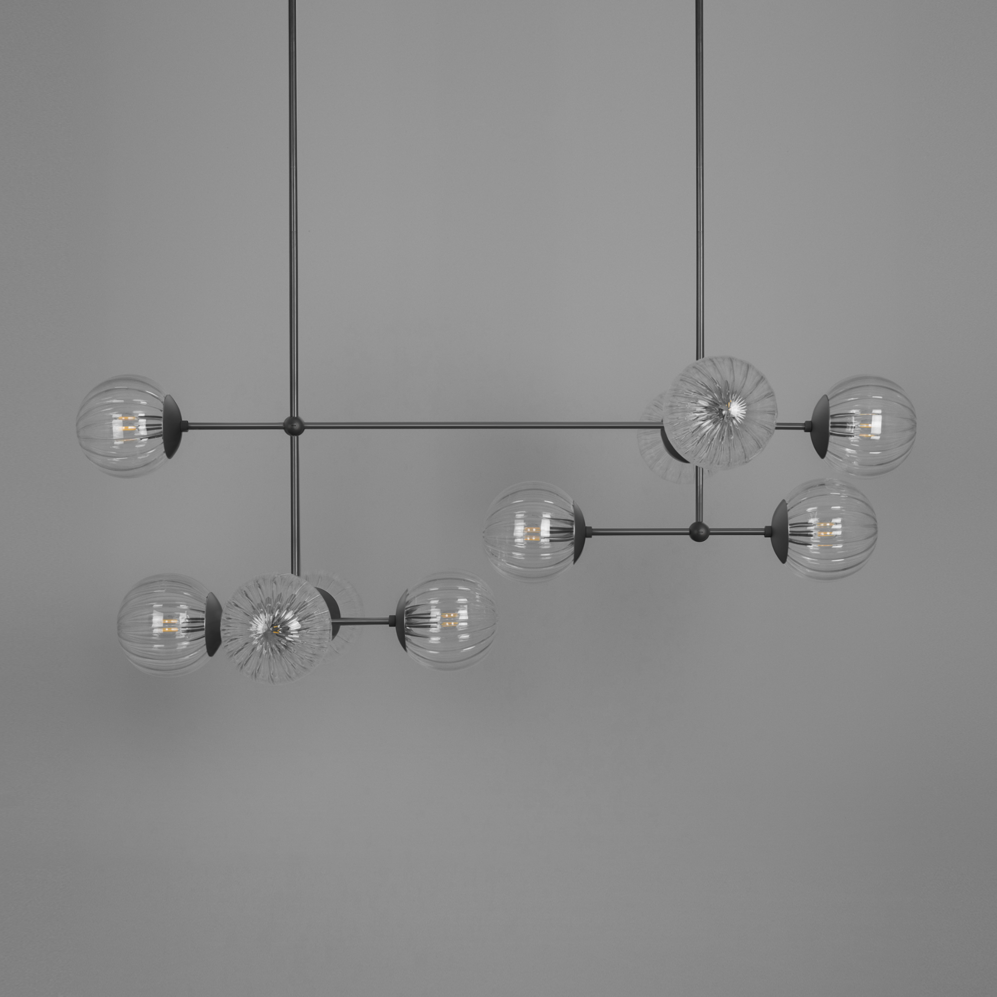 Schwung Armstrong Linear 10 Light Chandelier - Dries Ribbon Glass