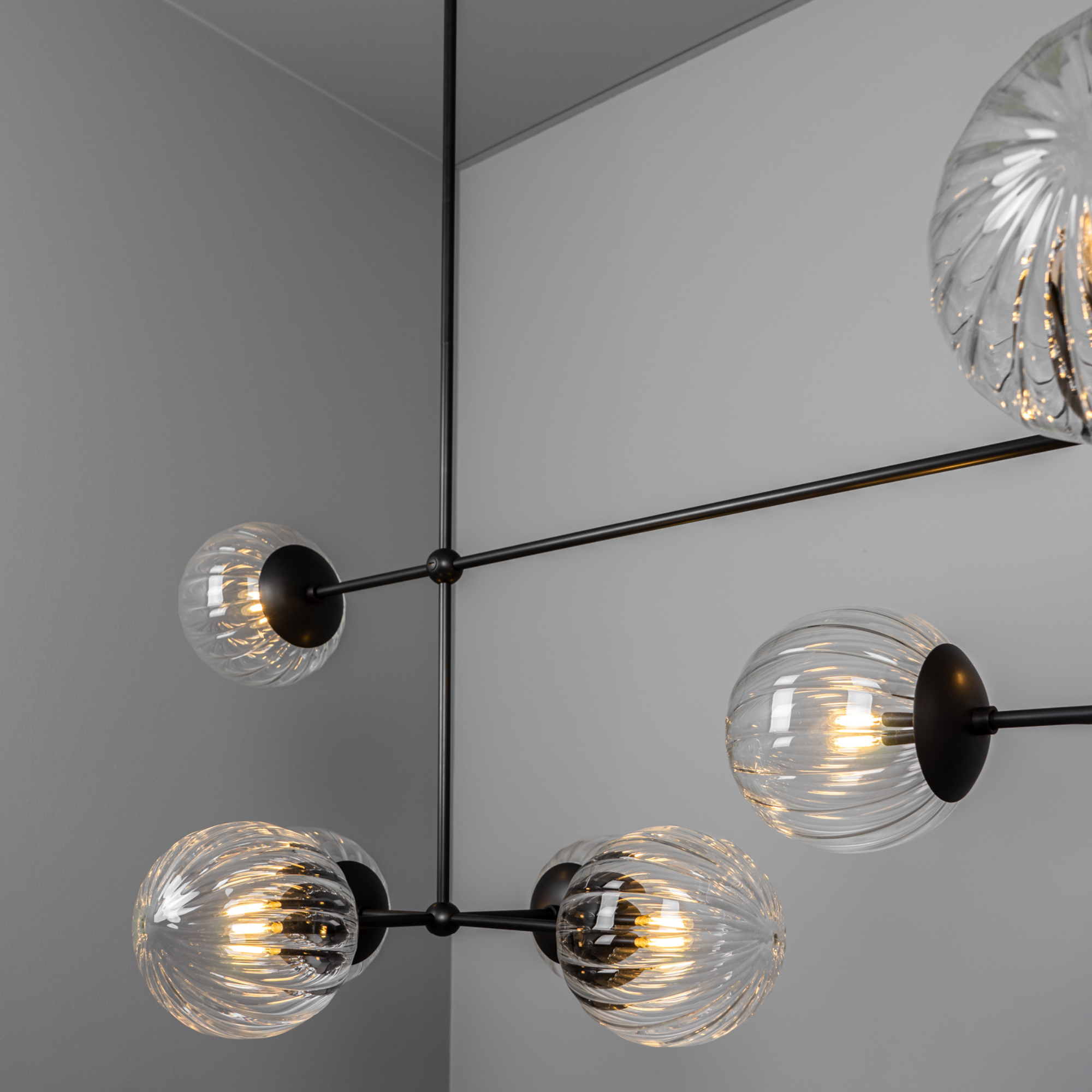 Schwung Armstrong Linear 10 Light Chandelier - Dries Ribbon Glass