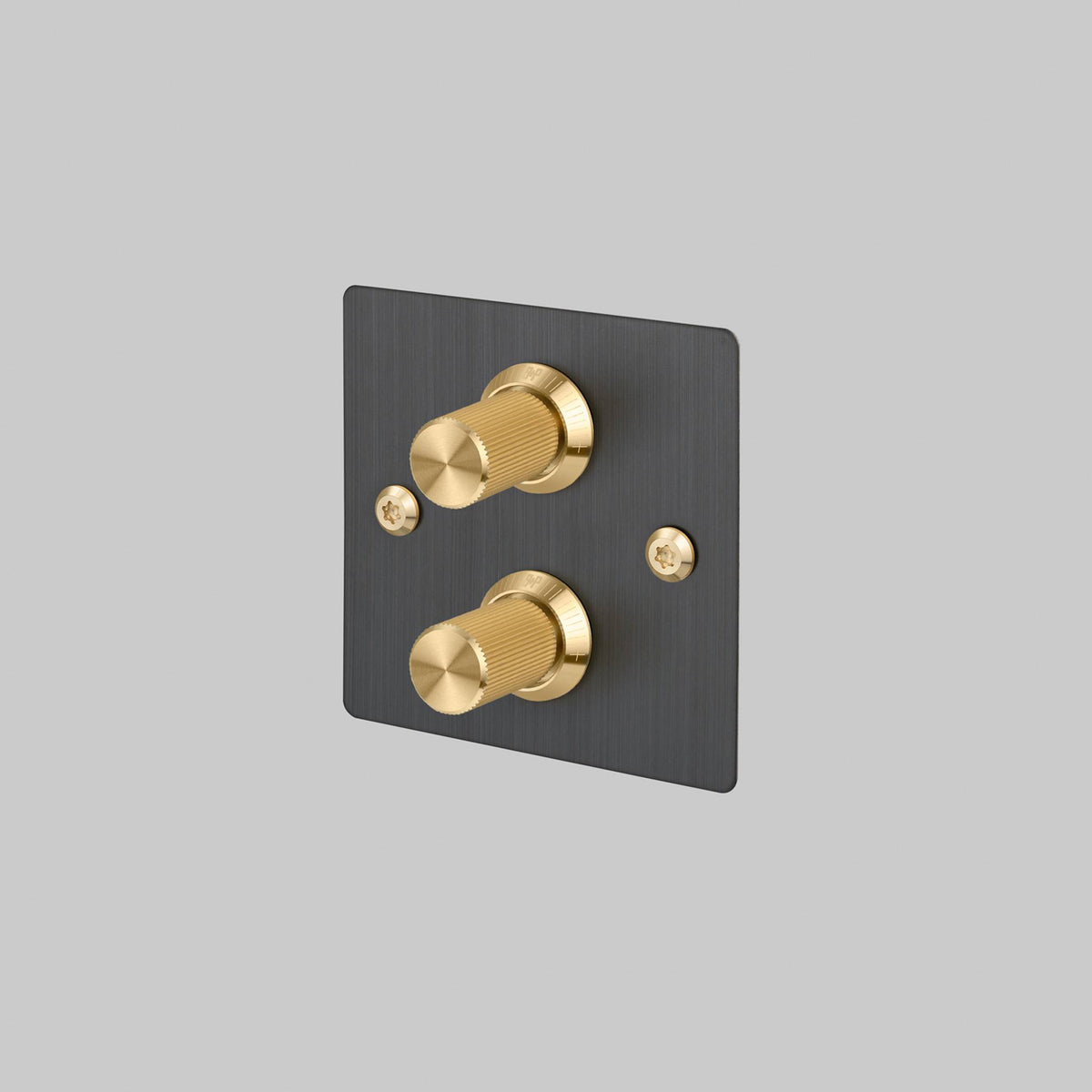 Buster + Punch 2G dimmer switch, smoked bronze plate with brass linear knurl knobs, front view