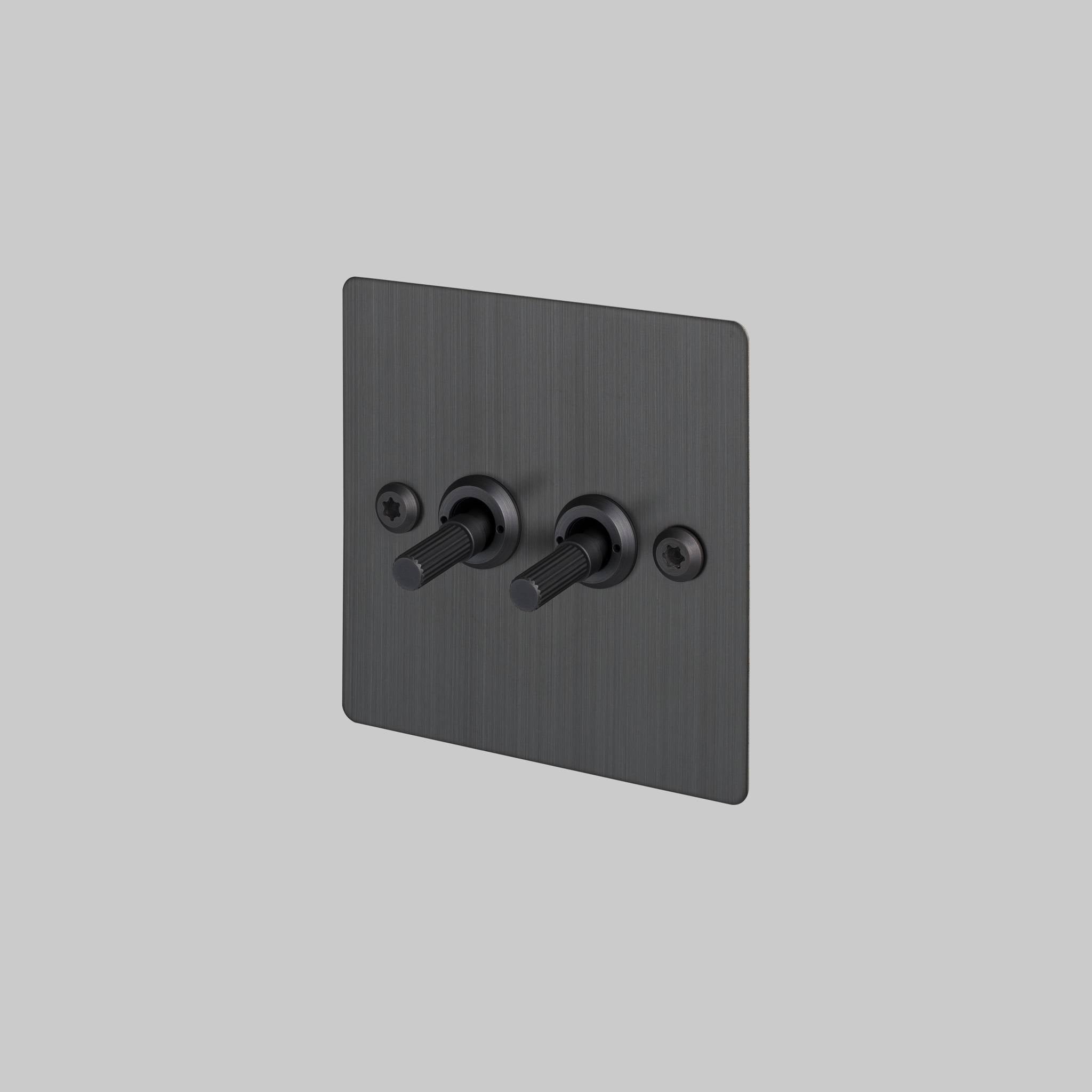 Buster + Punch 2G 2-way toggle switch, smoked bronze plate with smoked bronze linear knurl toggle arm, front view