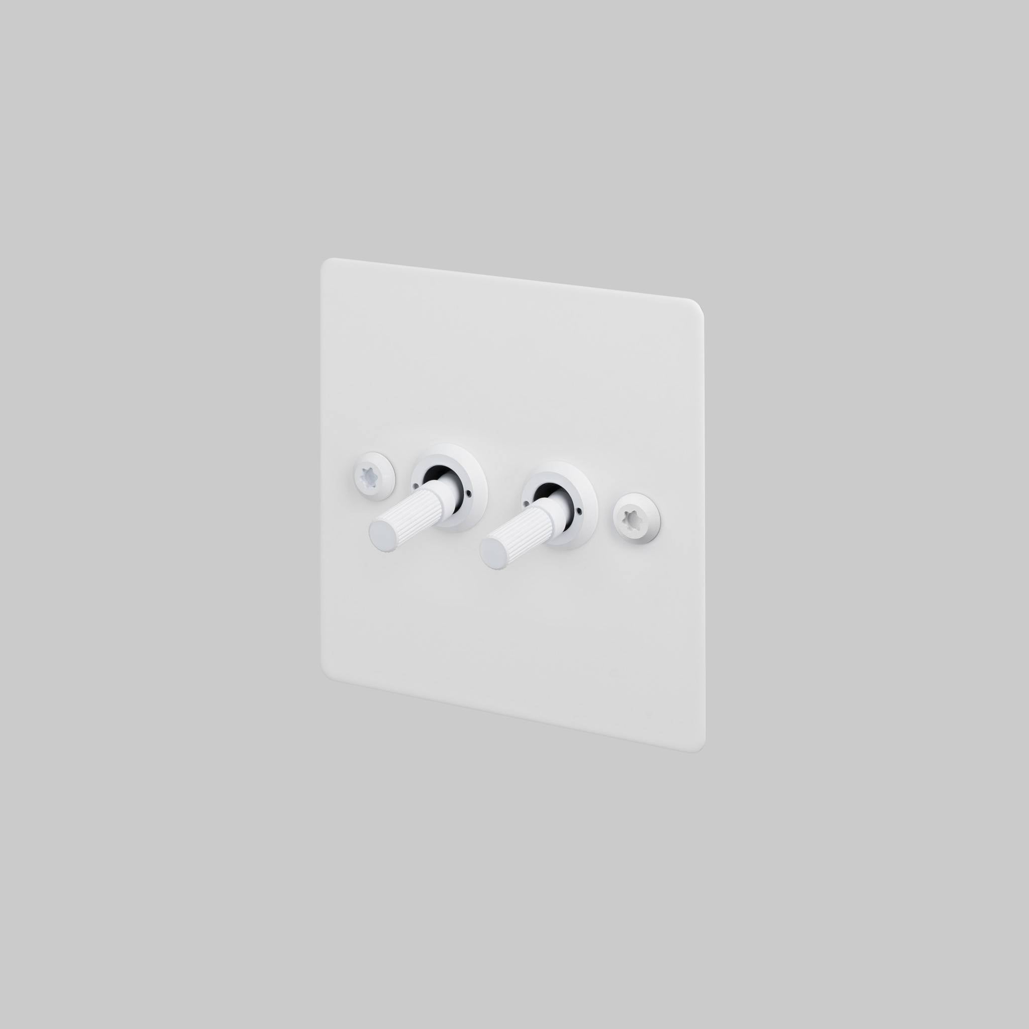 Buster + Punch 2G toggle switch, white plate with white linear knurl toggle arms, front view