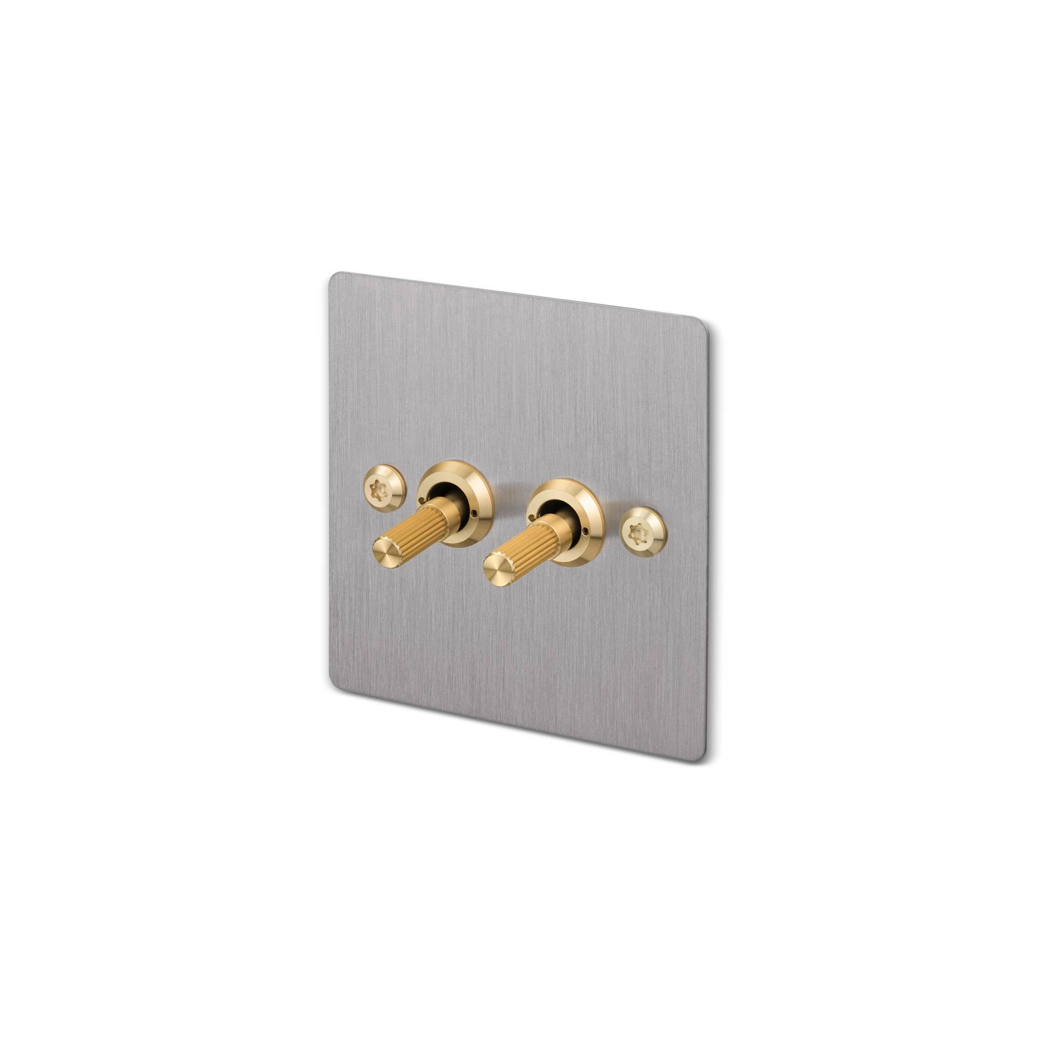 Buster + Punch 2G 2-way toggle switch, steel plate with brass linear knurl toggle arm, isolated cutout