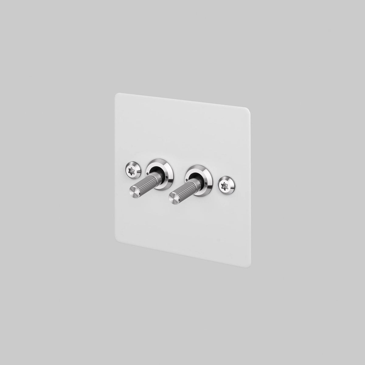 Buster + Punch 2G toggle switch, white plate with steel linear knurl toggle arms, front view