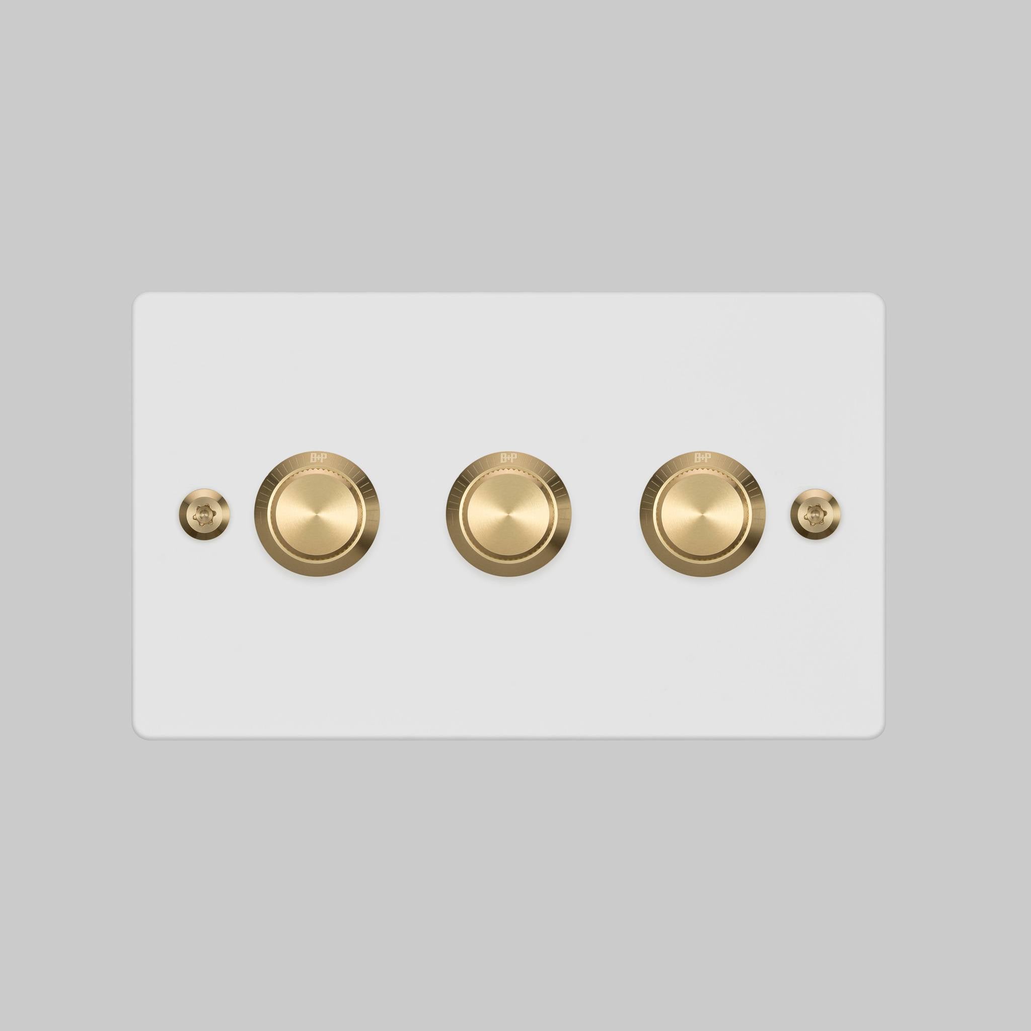 Buster + Punch 3G dimmer switch, White plate with Brass linear knurl knob, front elevation view